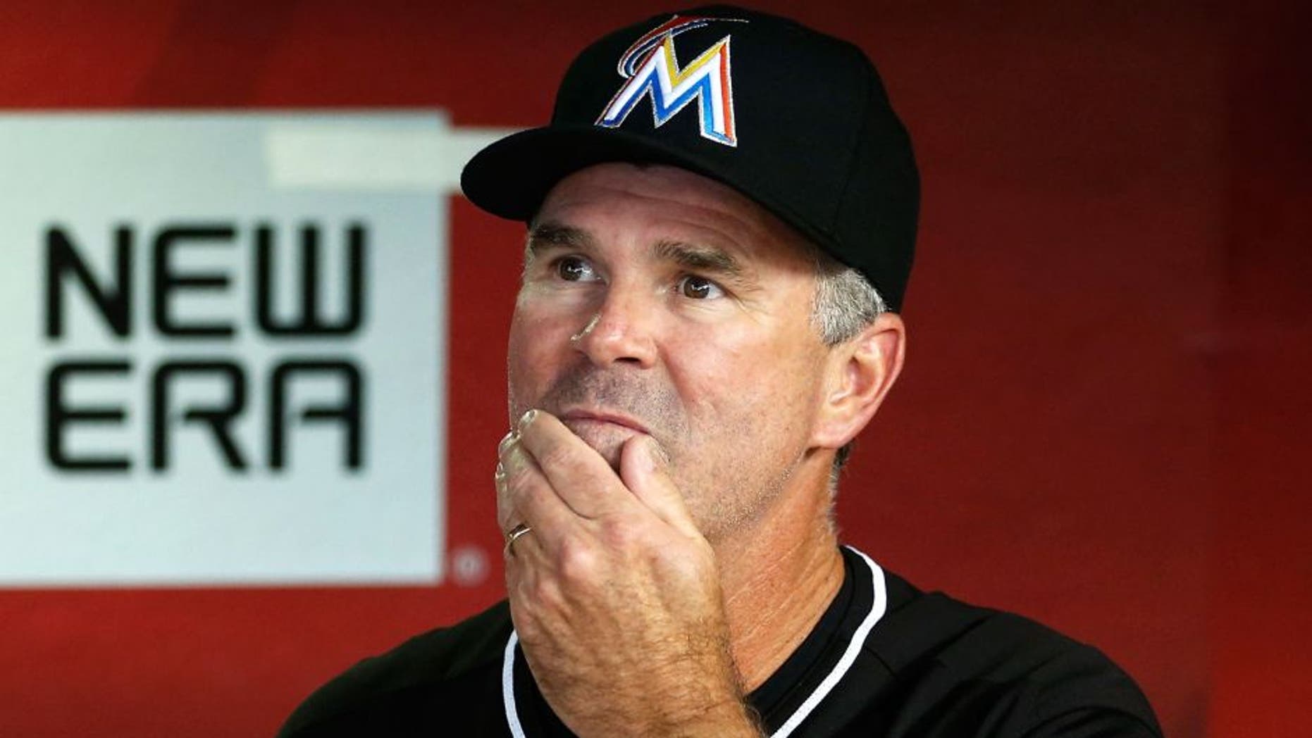 PHOENIX, AZ - JULY 21: Manager Dan Jennings #26 of the Miami Marlins watches from the dugout during the MLB game against the Arizona Diamondbacks at Chase Field on July 21, 2015 in Phoenix, Arizona. (Photo by Christian Petersen/Getty Images)