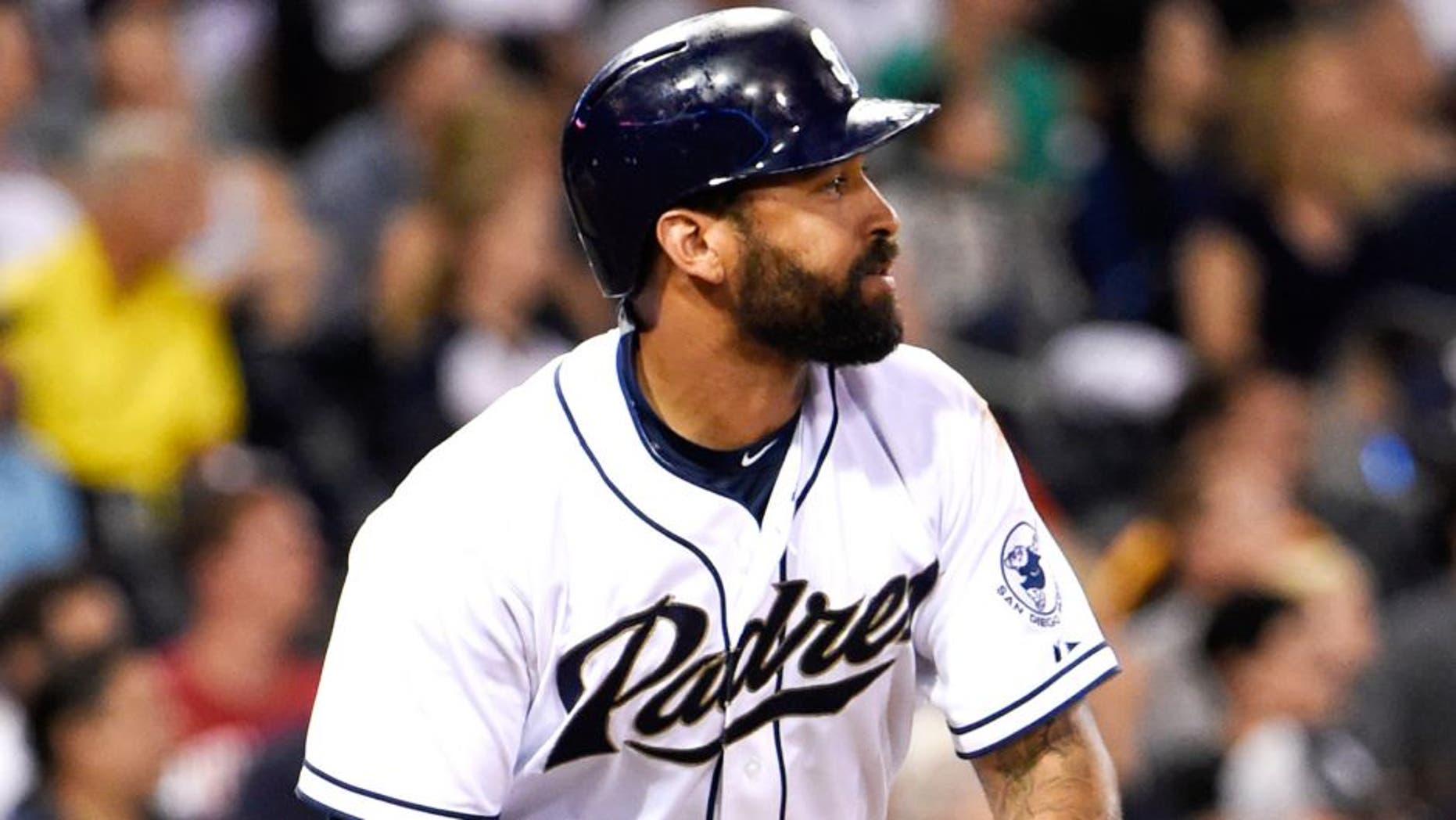SAN DIEGO, CA - JULY 23: Matt Kemp #27 of the San Diego Padres tosses his bat after hitting a long fly ball during the fourth inning of a baseball game against the Miami Marlins at Petco Park July 23, 2015 in San Diego, California. (Photo by Denis Poroy/Getty Images)