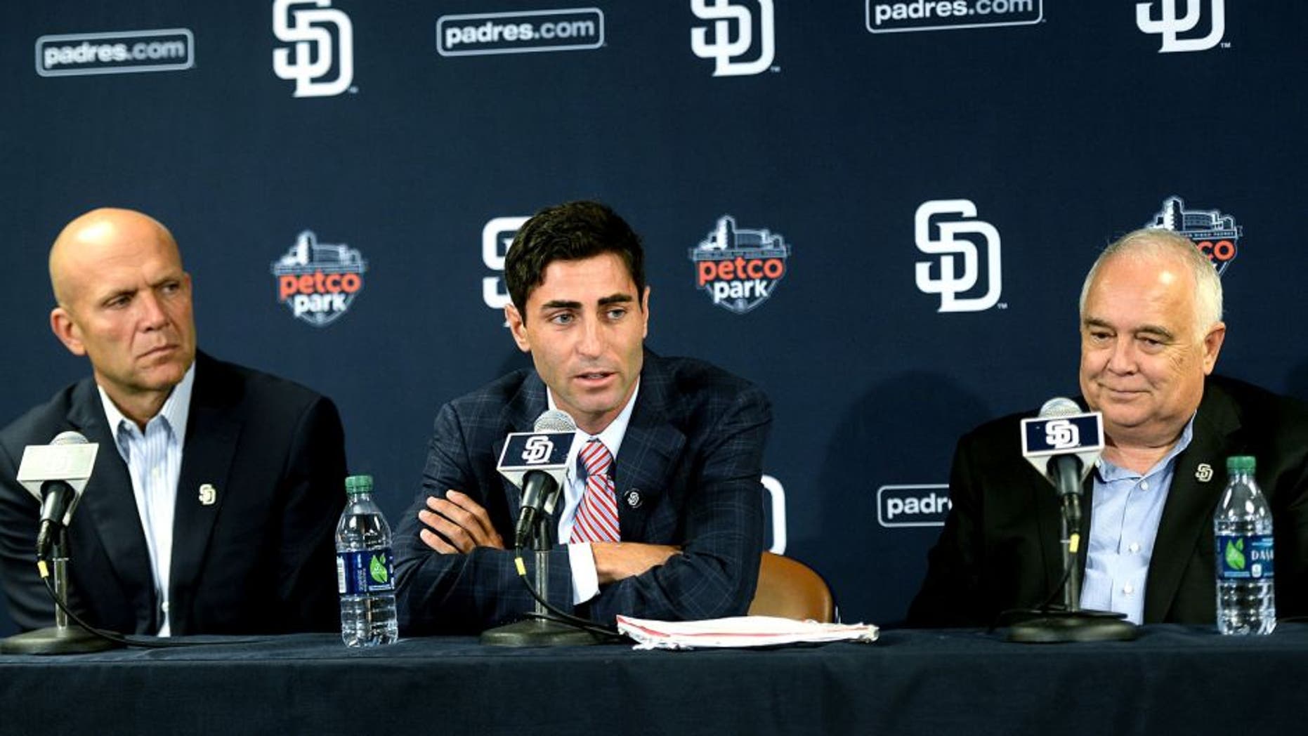 SAN DIEGO, CA - AUGUST 6: President & Chief Executive Officer Mike Dee and Executive Chairman Ron Fowler of the San Diego Padres listen as A.J. Preller speaks with the media as he is named the new General Manager of the San Diego Padres at a press conference at Petco Park on August 6, 2014 in San Diego, California. (Photo by Andy Hayt/San Diego Padres/Getty Images) *** LOCAL CAPTION *** A.J. Preller;Mike Dee;Ron Fowler