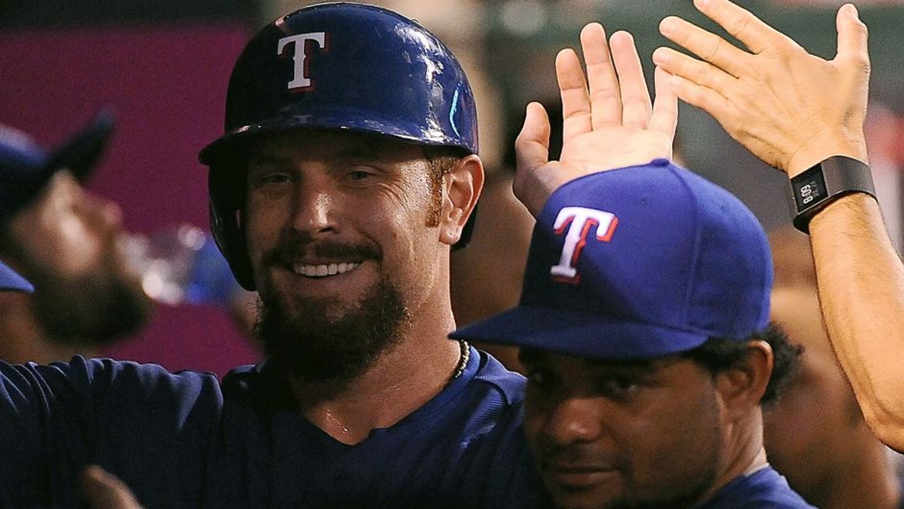 ANAHEIM, CA - JULY 24: Josh Hamilton #32 of the Texas Rangers celebrates after scoring on a throwing error by Nick Tropeano #35 of the Los Angeles Angels of Anaheim (not pictured) in the fifth inning during a game at Angel Stadium of Anaheim on July 24, 2015 in Anaheim, California. (Photo by Jonathan Moore/Getty Images)