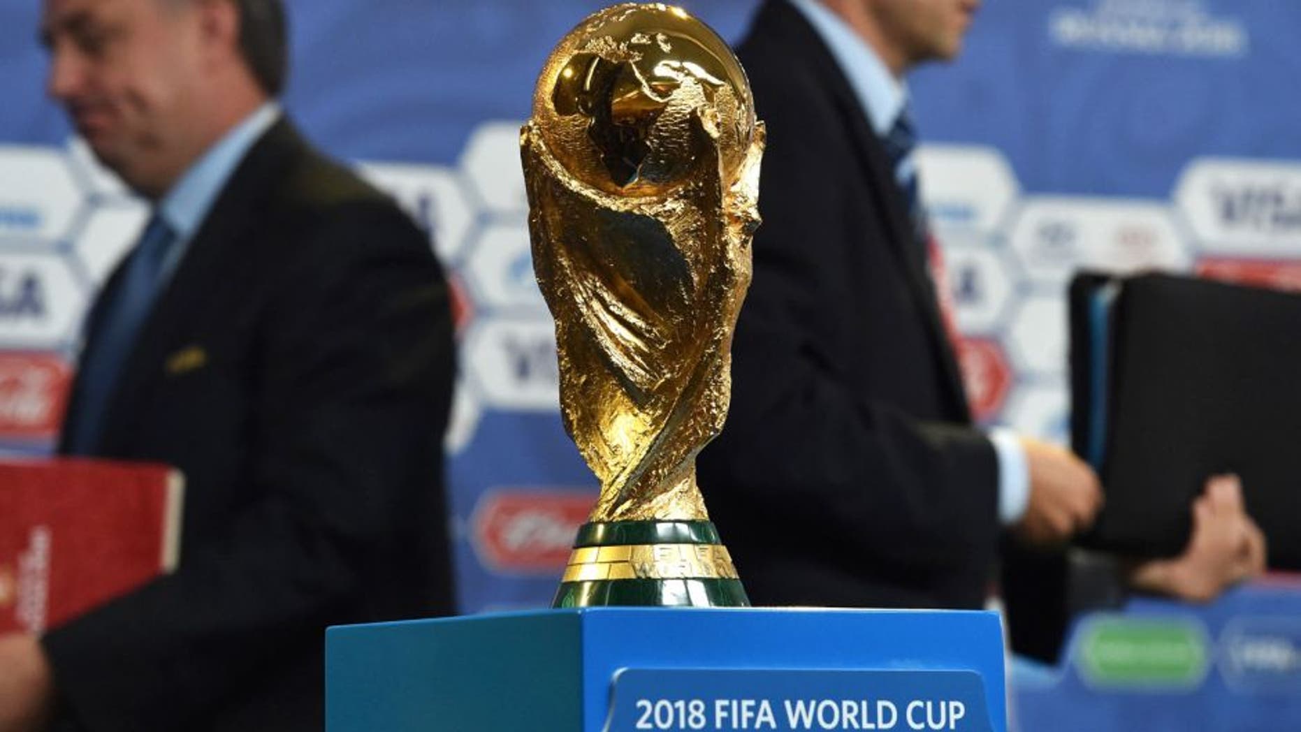 The FIFA World Cup trophy stands on a podium at a hall close to the Constantine (Konstantinovsky) Palace in St. Petersburg on July 24, 2015 on the eve of the Preliminary draw for the 2018 FIFA World Cup. The trophy created by Italian sculptor Silvio Gazzaniga for the 1974 World Cup, measures 36cm in height, is made out of 18-carat gold and weighs 6175g. AFP PHOTO / KIRILL KUDRYAVTSEV (Photo credit should read KIRILL KUDRYAVTSEV/AFP/Getty Images)
