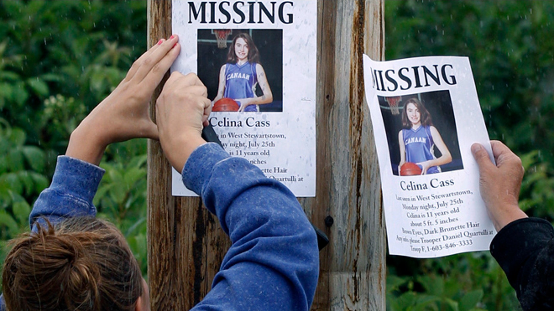 July 28, 2011: file photo, Kaylin Pettit, of Stewartstown, N.H., left, and Lori McKearney, of Lancaster, N.H. tack missing posters for Celina Cass to a utility pole in Colebrook, N.H.
