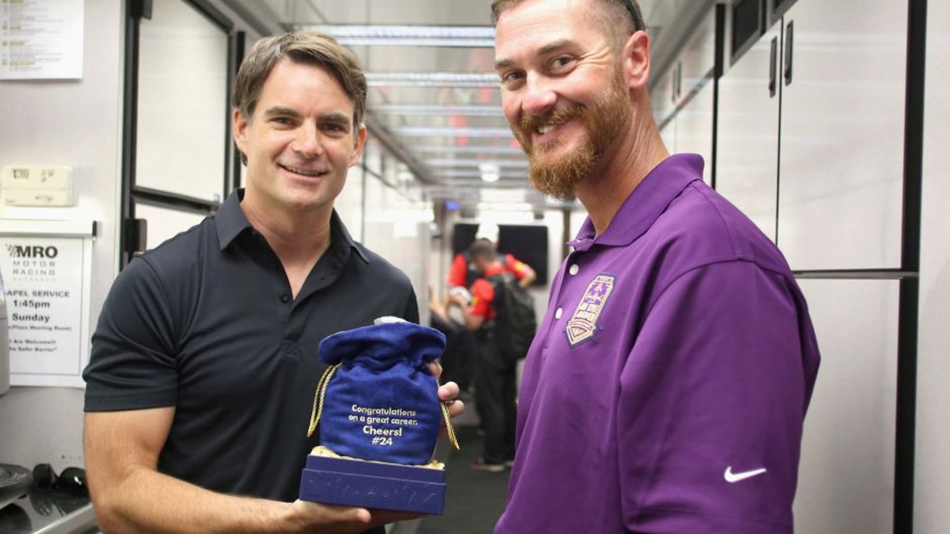 INDIANAPOLIS, IN - JULY 25: Brickyard 400 namesake Jeff Kyle presents a bottle of Crown Royal XR to Jeff Gordon at Indianapolis Motor Speedway on July 25, 2015 in Indianapolis, Indiana. (Photo by Marianna Massey/Getty Images for Crown Royal) *** Local Caption *** Jeff Gordon;Jeff Kyle