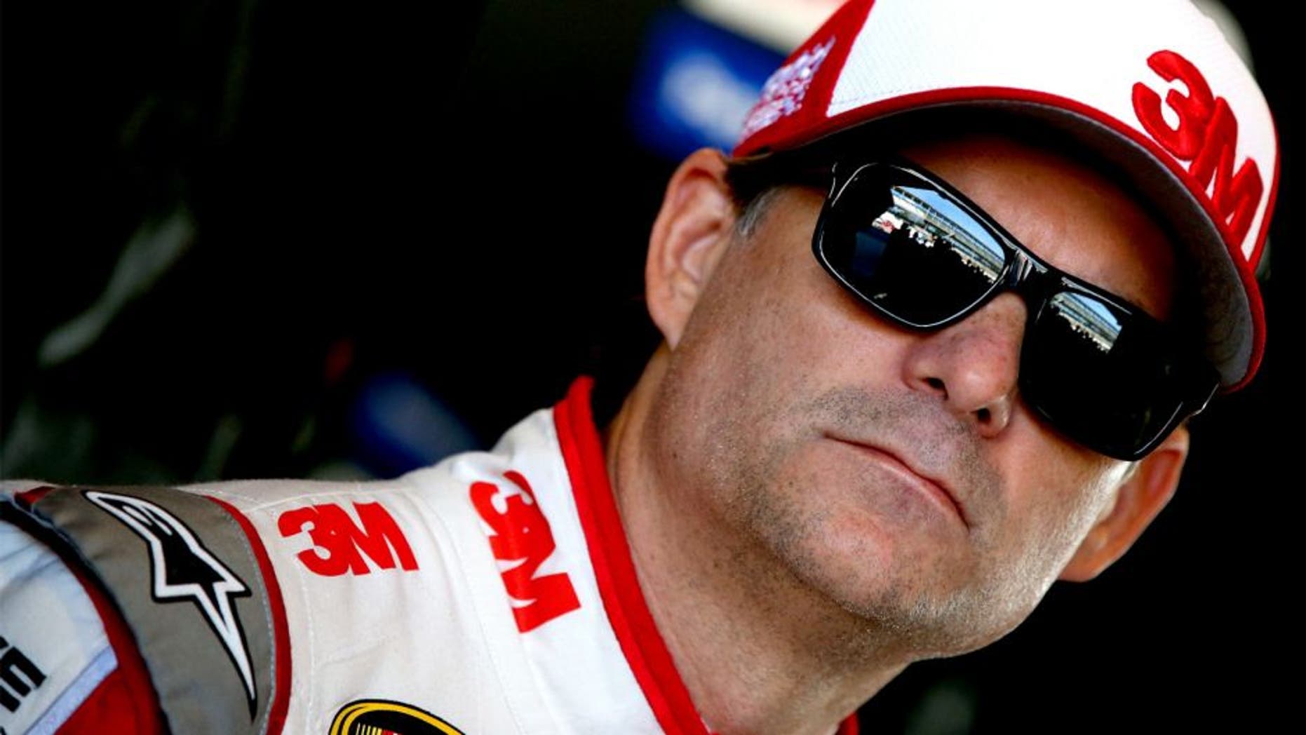 INDIANAPOLIS, IN - JULY 24: Jeff Gordon, driver of the #24 3M Chevrolet, stands in the garage area during practice for the NASCAR Sprint Cup Series Crown Royal Presents the Jeff Kyle 400 at the Brickyard at Indianapolis Motorspeedway on July 24, 2015 in Indianapolis, Indiana. (Photo by Sean Gardner/NASCAR via Getty Images)