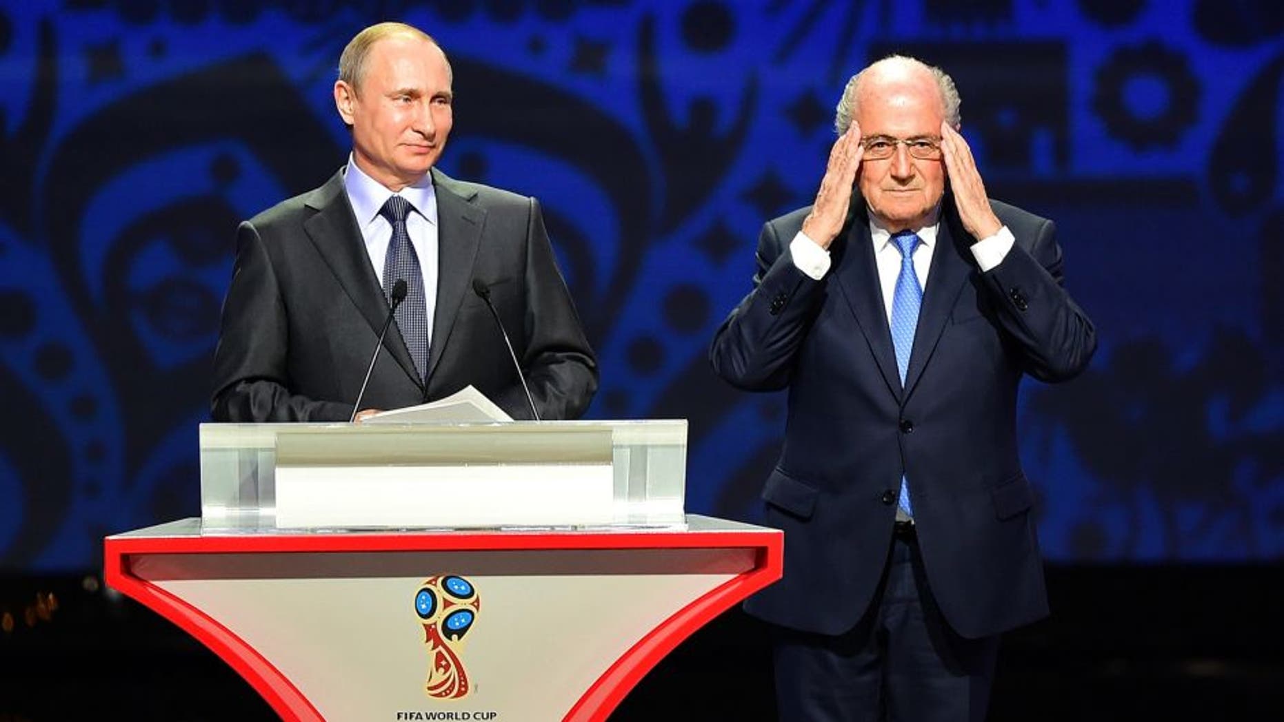 SAINT PETERSBURG, RUSSIA - JULY 25: Vladimir Putin, President of Russia and FIFA President Joseph S. Blatter speak during the Preliminary Draw of the 2018 FIFA World Cup in Russia at The Konstantin Palace on July 25, 2015 in Saint Petersburg, Russia. (Photo by Shaun Botterill/Getty Images)