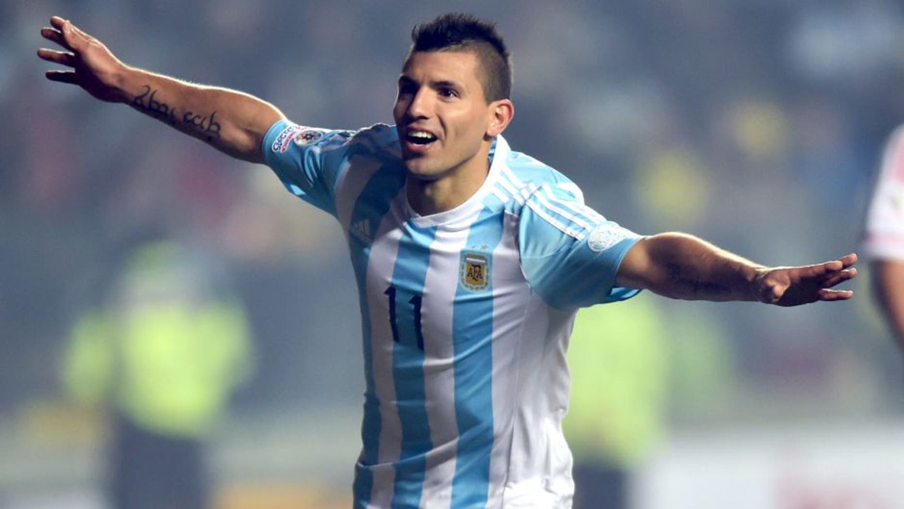 Argentina's forward Sergio Aguero (L) celebrates after scoring against Paraguay during their Copa America semifinal football match in Concepcion, Chile on June 30, 2015. AFP PHOTO / YURI CORTEZ (Photo credit should read YURI CORTEZ/AFP/Getty Images)