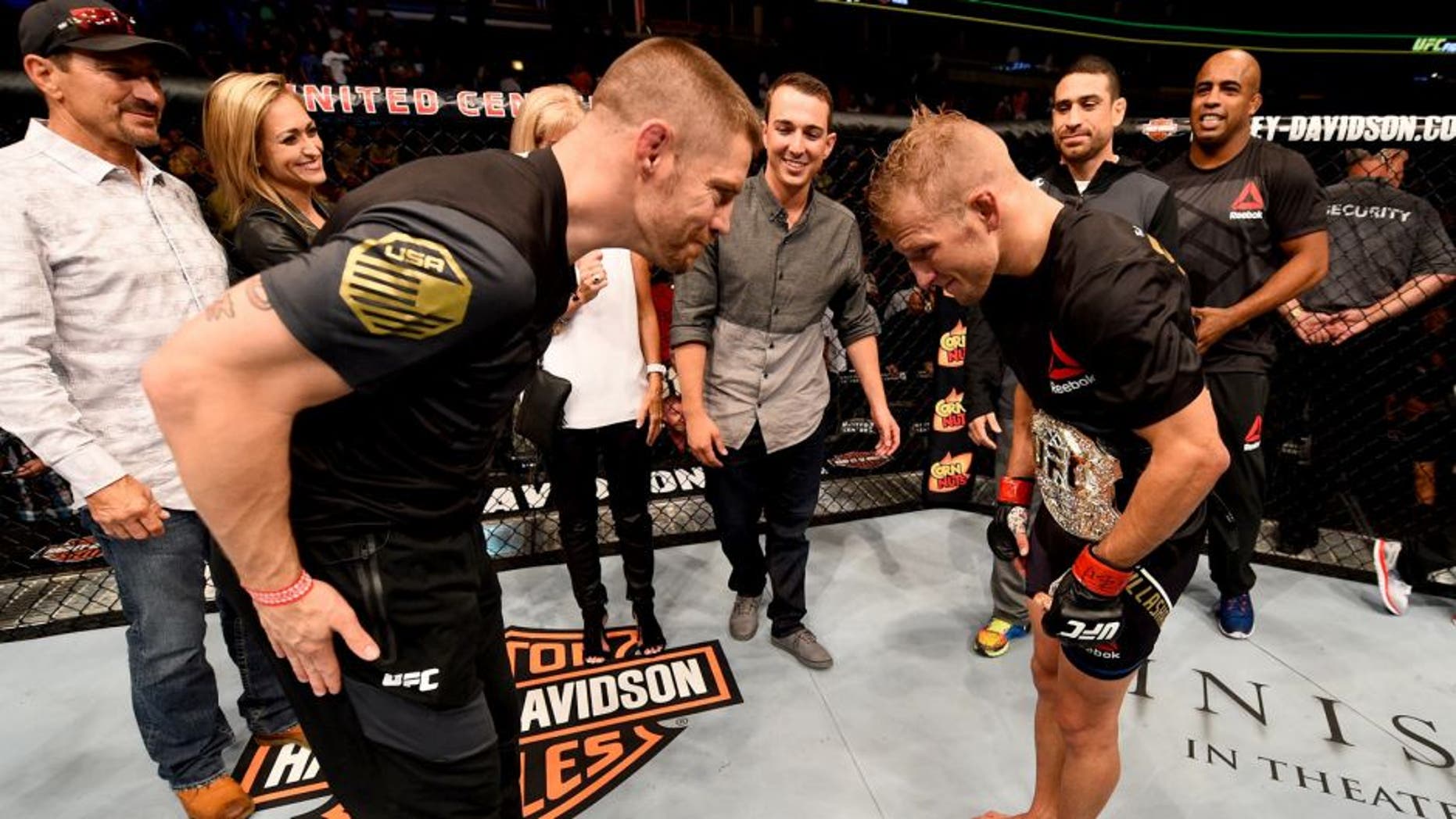 CHICAGO, IL - JULY 25: TJ Dillashaw (R) is congratulated by coach Duane Ludwig after his TKO victory over Renan Barao of Brazil in their UFC bantamweight championship bout during the UFC event at the United Center on July 25, 2015 in Chicago, Illinois. (Photo by Jeff Bottari/Zuffa LLC/Zuffa LLC via Getty Images)