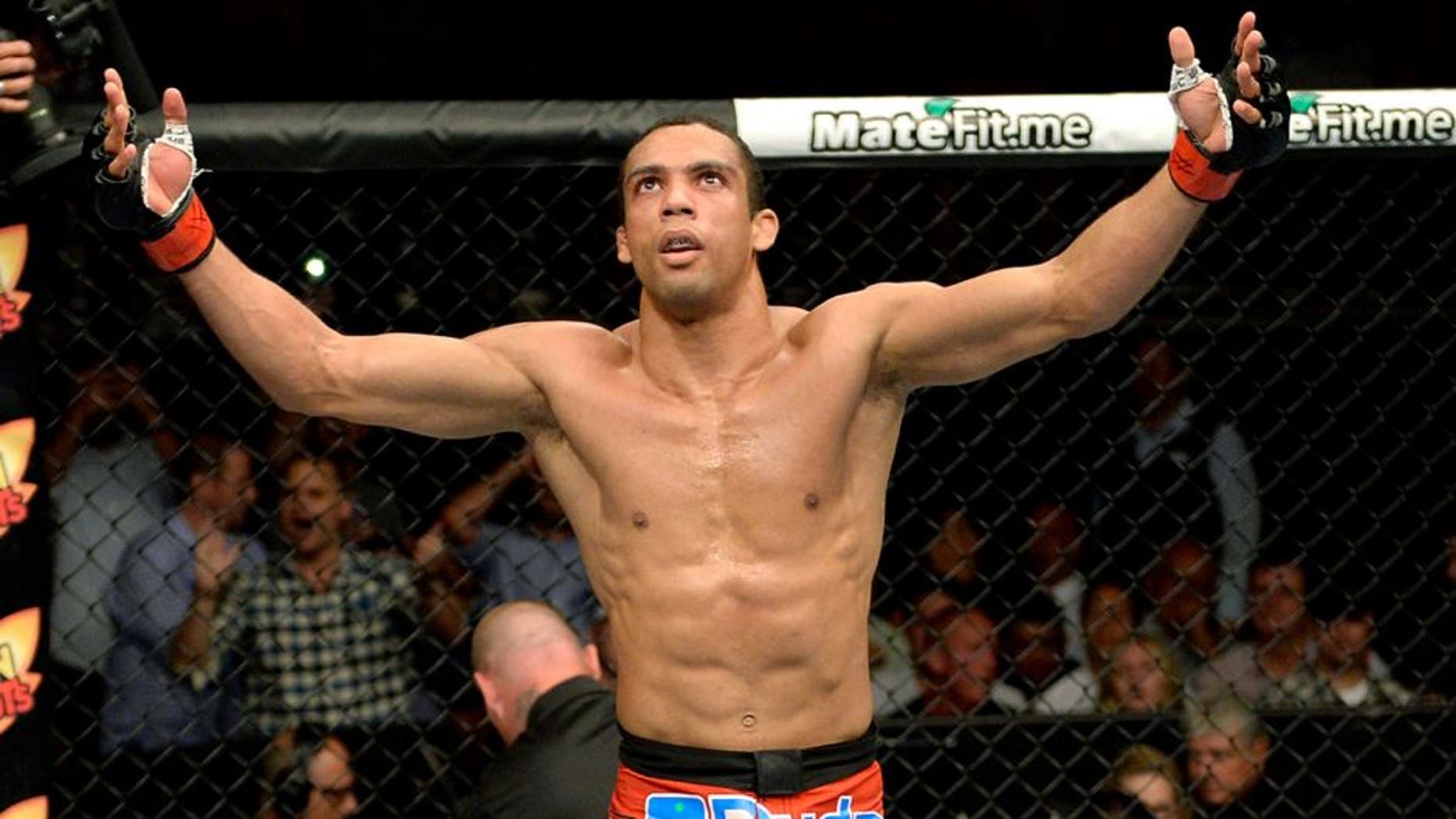 ATLANTIC CITY, NJ - JULY 16: (L-R) Edson Barboza celebrates after defeating Evan Dunham in their lightweight bout during the UFC Fight Night event at Revel Casino on July 16, 2014 in Atlantic City, New Jersey. (Photo by Jeff Bottari/Zuffa LLC/Zuffa LLC via Getty Images)