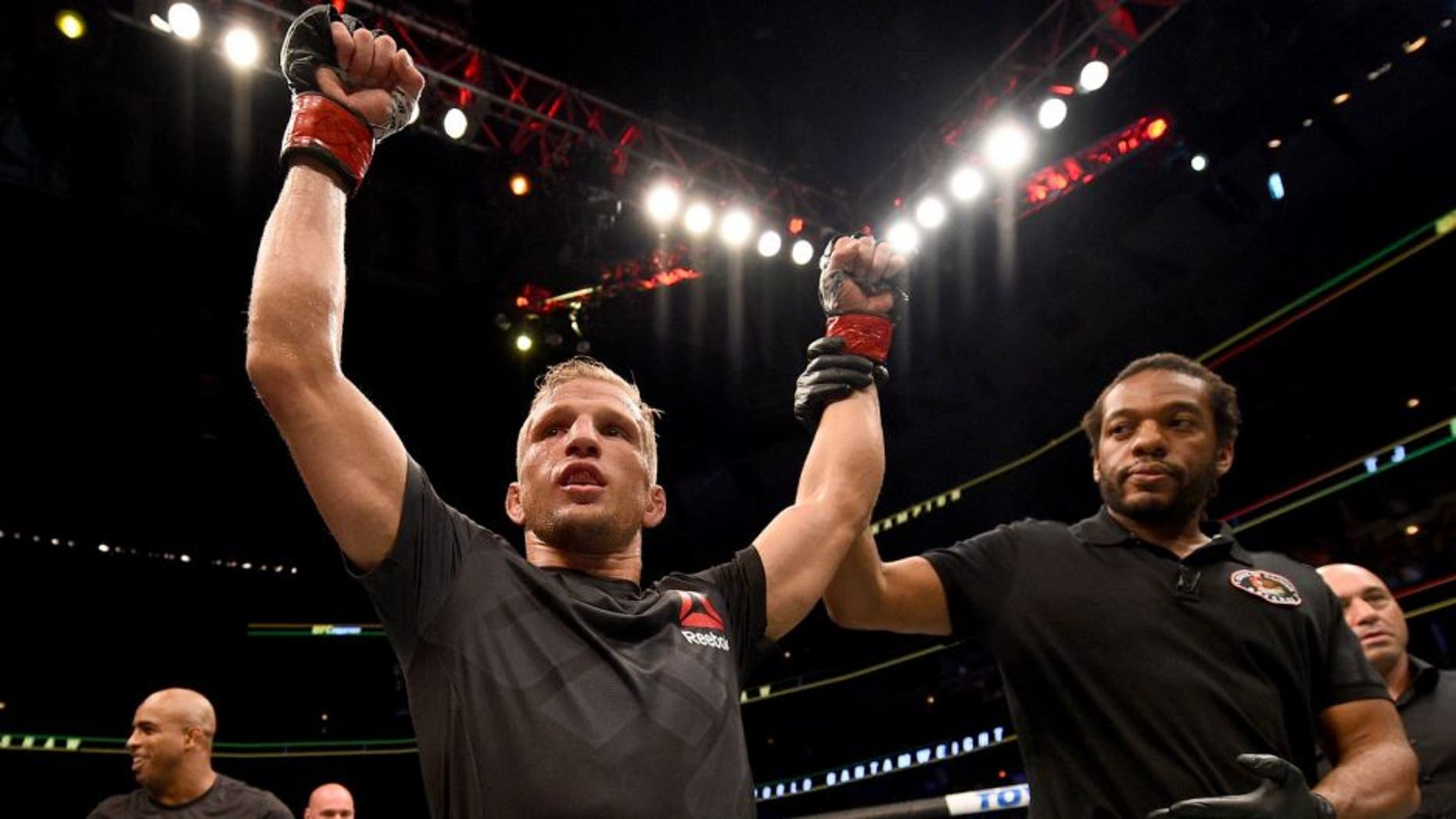 CHICAGO, IL - JULY 25: TJ Dillashaw celebrates after his TKO victory over Renan Barao of Brazil in their UFC bantamweight championship bout during the UFC event at the United Center on July 25, 2015 in Chicago, Illinois. (Photo by Jeff Bottari/Zuffa LLC/Zuffa LLC via Getty Images)