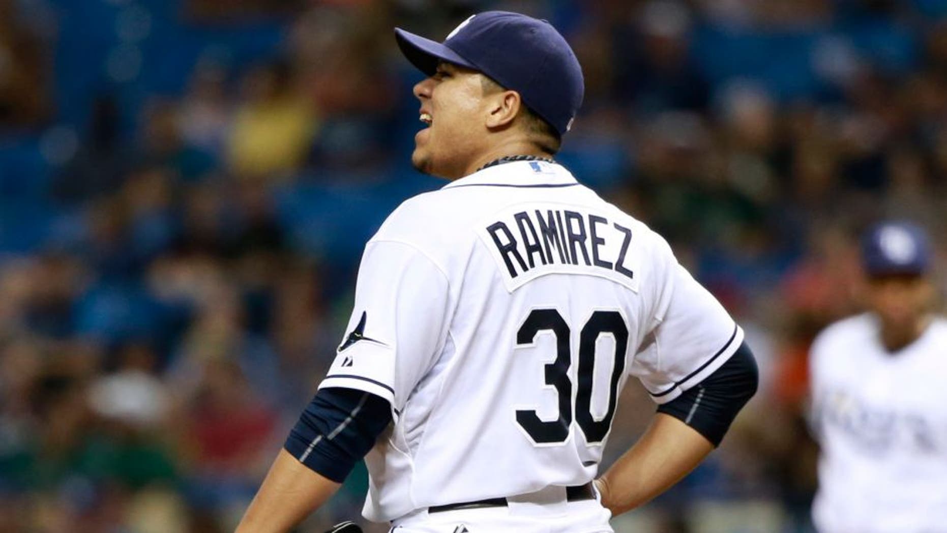 Jul 25, 2015; St. Petersburg, FL, USA; Tampa Bay Rays starting pitcher Erasmo Ramirez (30) reacts after giving up a grand slam during the third inning against the Tampa Bay Rays at Tropicana Field. Mandatory Credit: Kim Klement-USA TODAY Sports