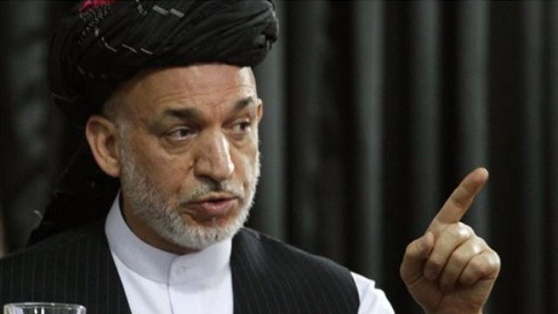 June 13: Afghan President Hamid Karzai speaks during a gathering in Kandahar, south of Kabul, Afghanistan (AP).