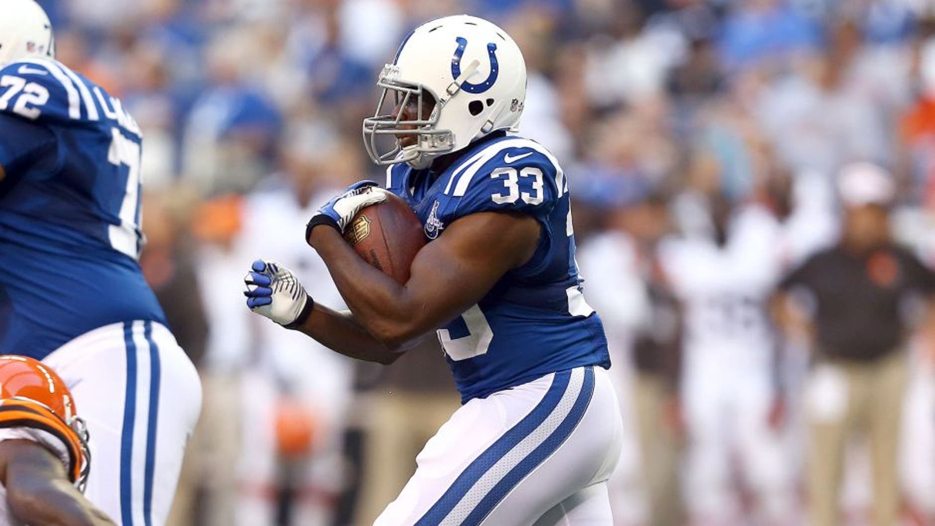 INDIANAPOLIS, IN - AUGUST 24: Vick Ballard #33 of Indianapolis Colts runs with the ball during the preseason game against the Cleveland Browns at Lucas Oil Stadium on August 24, 2013 in Indianapolis, Indiana. (Photo by Andy Lyons/Getty Images)