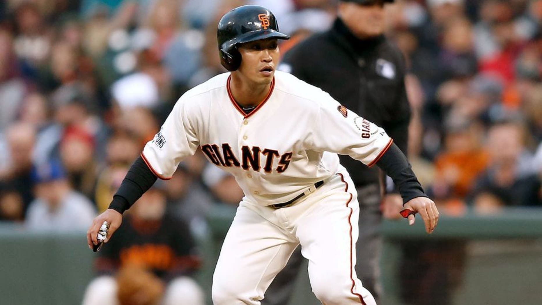 SAN FRANCISCO, CA - JUNE 15: Base runner Nori Aoki #23 of the San Francisco Giants watches play from first base in the second inning against the Seattle Mariners at AT&T Park on June 15, 2015 in San Francisco, California. (Photo by Lachlan Cunningham/Getty Images)