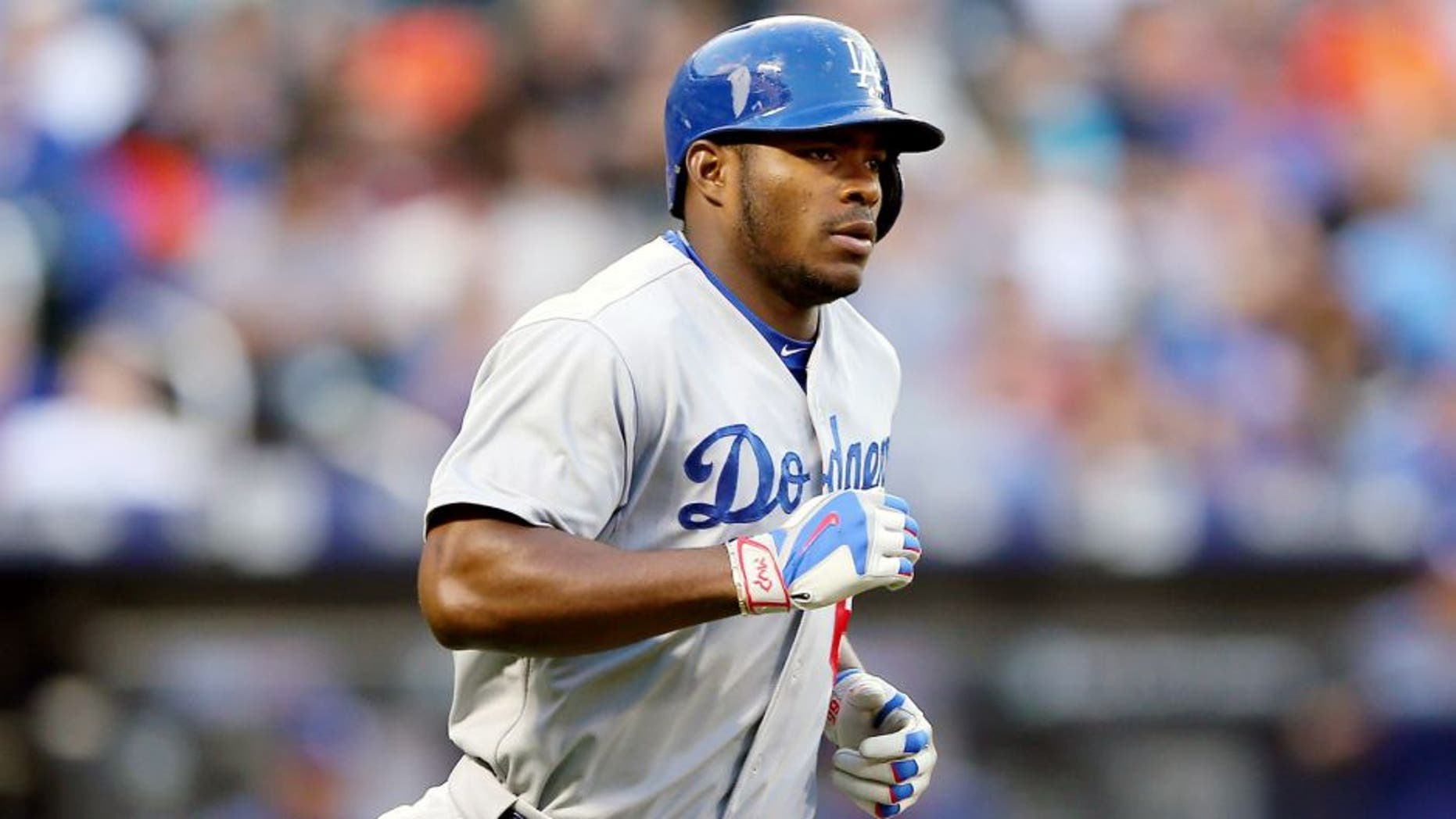 NEW YORK, NY - JULY 24: Yasiel Puig #66 of the Los Angeles Dodgers rounds first after his two run home run in the third inning against the New York Mets on July 24, 2015 at Citi Field in the Flushing neighborhood of the Queens borough of New York City. (Photo by Elsa/Getty Images)
