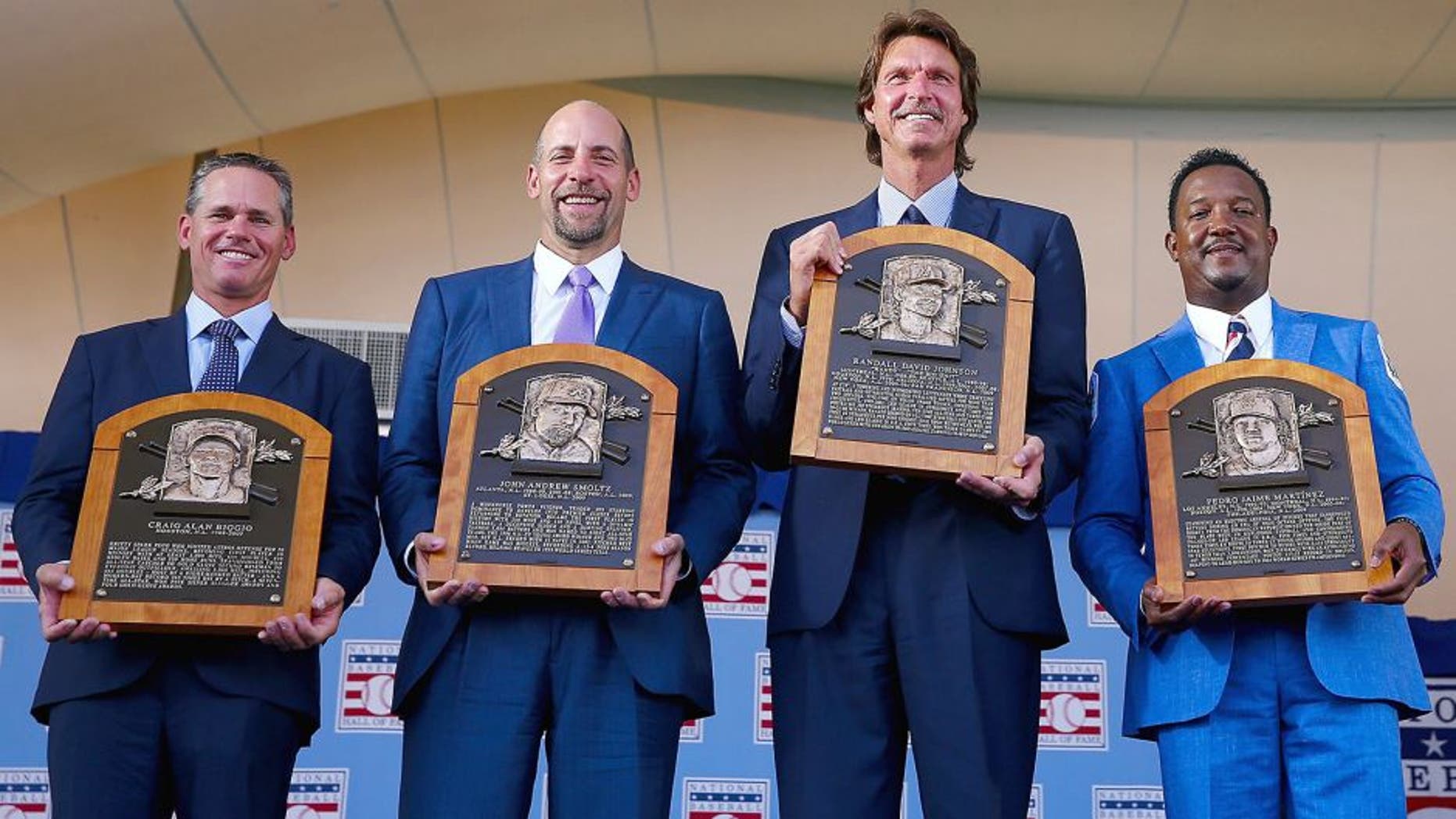 COOPERSTOWN, NY - JULY 26: 2015 Inductees Craig Biggio,John Smoltz,Randy Johnson and Pedro Martinez pose with their plaques after the Induction Ceremony at National Baseball Hall of Fame on July 26, 2015 in Cooperstown, New York. (Photo by Elsa/Getty Images)