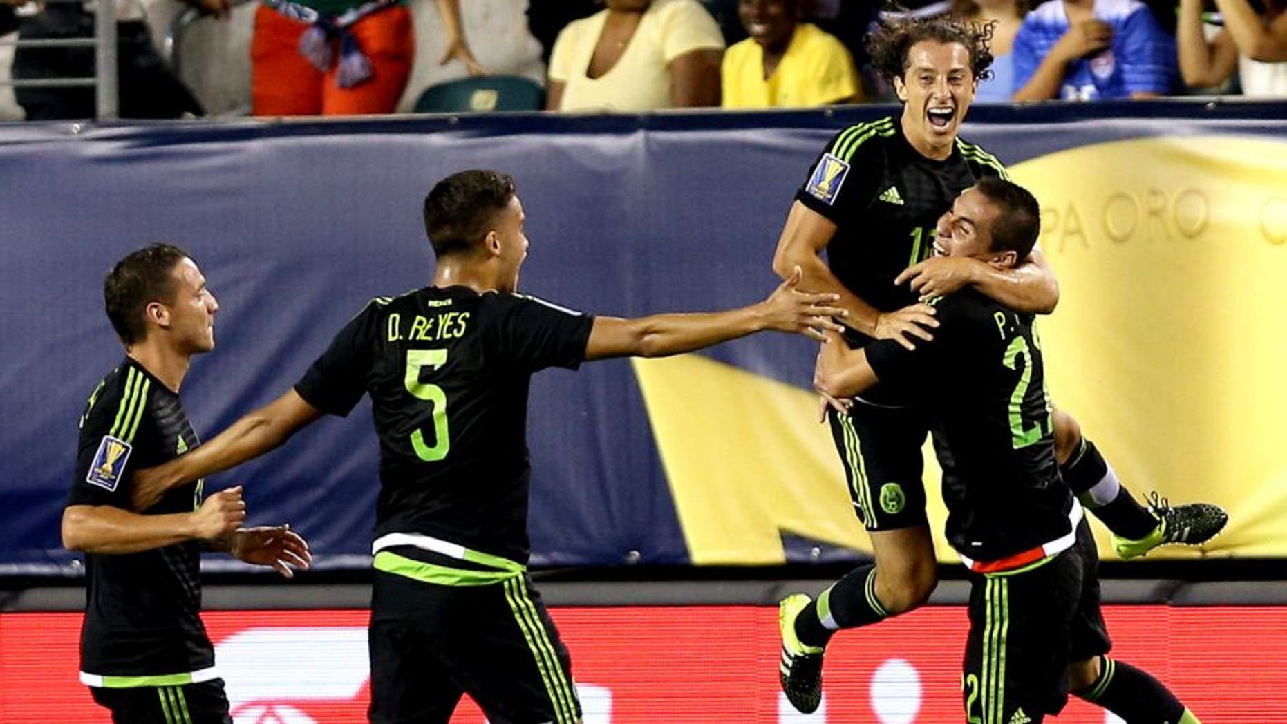 PHILADELPHIA, PA - JULY 26: Andres Guardado #18 of Mexico celebrates with teammates after scoring in the first half against Jamaica during the CONCACAF Gold Cup Final at Lincoln Financial Field on July 26, 2015 in Philadelphia, Pennsylvania. (Photo by Patrick Smith/Getty Images)