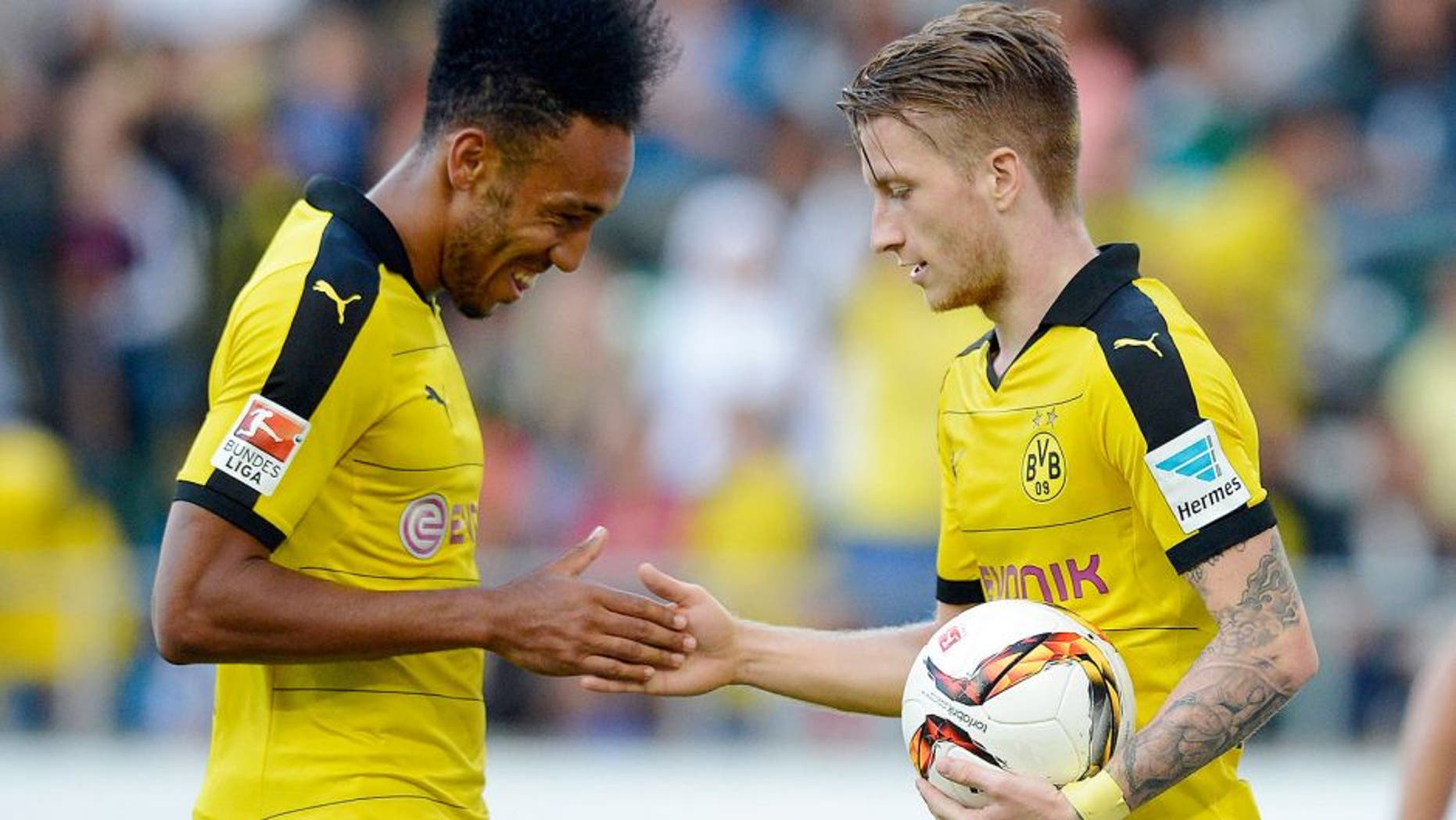 ST GALLEN, SWITZERLAND - JULY 25: Marco Reus of Dortmund (R) celebrates his team's second goal with team mate Pierre-Emerick Aubameyang during the friendly match between Juventus and Borussia Dortmund on July 25, 2015 in St Gallen, Switzerland. (Photo by Daniel Kopatsch/Getty Images)