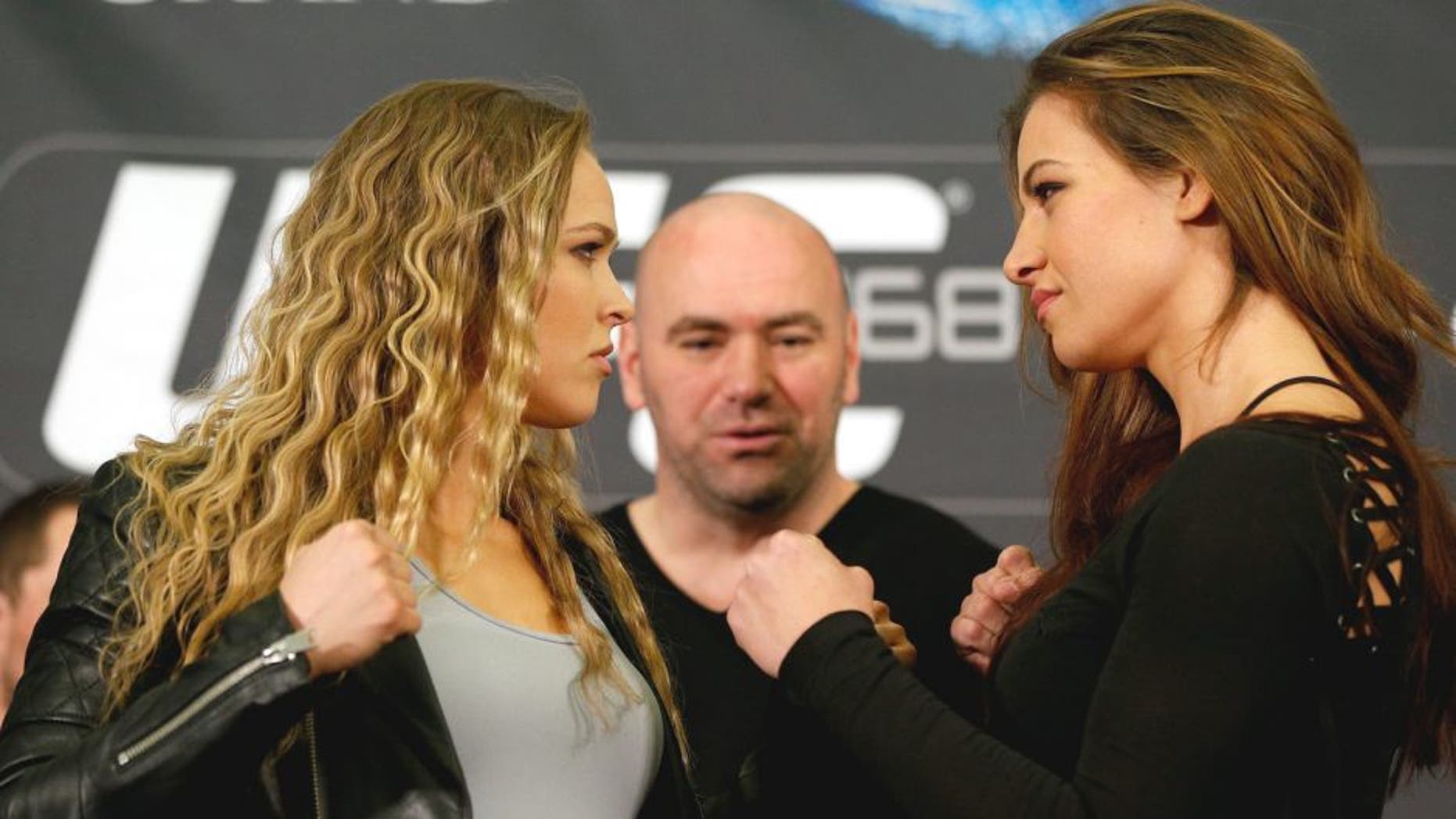 LAS VEGAS, NV - DECEMBER 26: (L-R) Opponents Ronda Rousey and Miesha Tate face off during the UFC 168 pre-fight press conference at the MGM Grand Hotel/Casino on December 26, 2013 in Las Vegas, Nevada. (Photo by Josh Hedges/Zuffa LLC/Zuffa LLC via Getty Images)