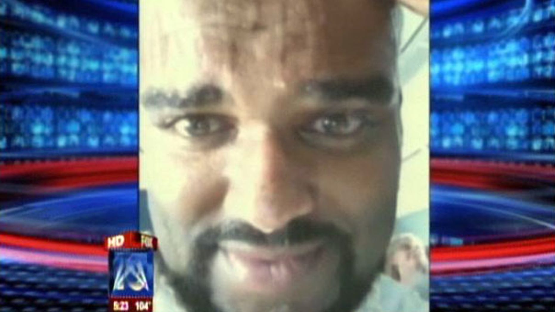 Tony Morales of Scottsdale, Ariz., is seen on a YouTube video he shot while stuck aboard a sweltering Delta Airlines flight for three hours.