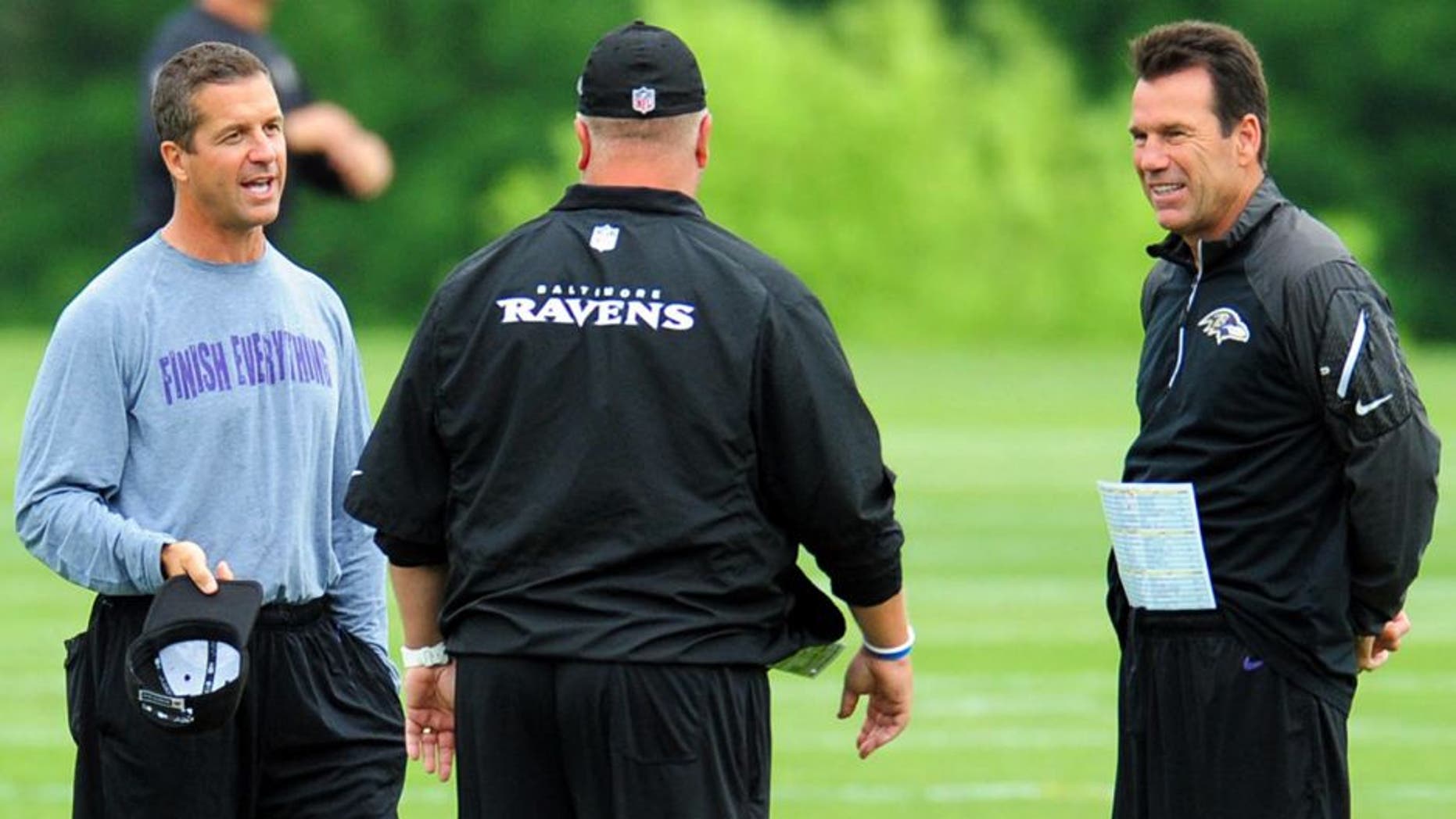 Jun 19, 2014; Baltimore, MD, USA; Baltimore Ravens head coach John Harbaugh (left) and offensive coordinator Gary Kubiak (right) talk during minicamp at the Under Armour Performance Center. Mandatory Credit: Evan Habeeb-USA TODAY Sports
