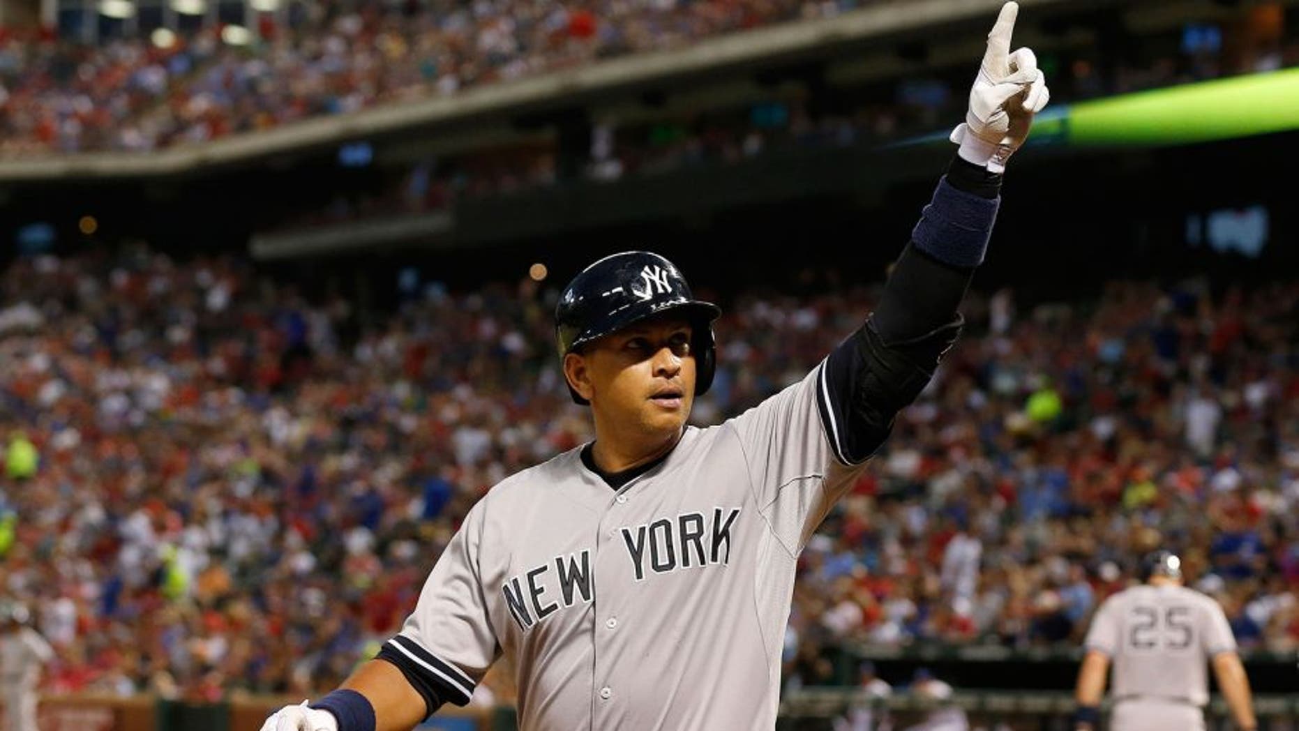 Jul 27, 2015; Arlington, TX, USA; New York Yankees designated hitter Alex Rodriguez (13) celebrates a solo home run in the sixth inning against the Texas Rangers at Globe Life Park in Arlington. Mandatory Credit: Matthew Emmons-USA TODAY Sports