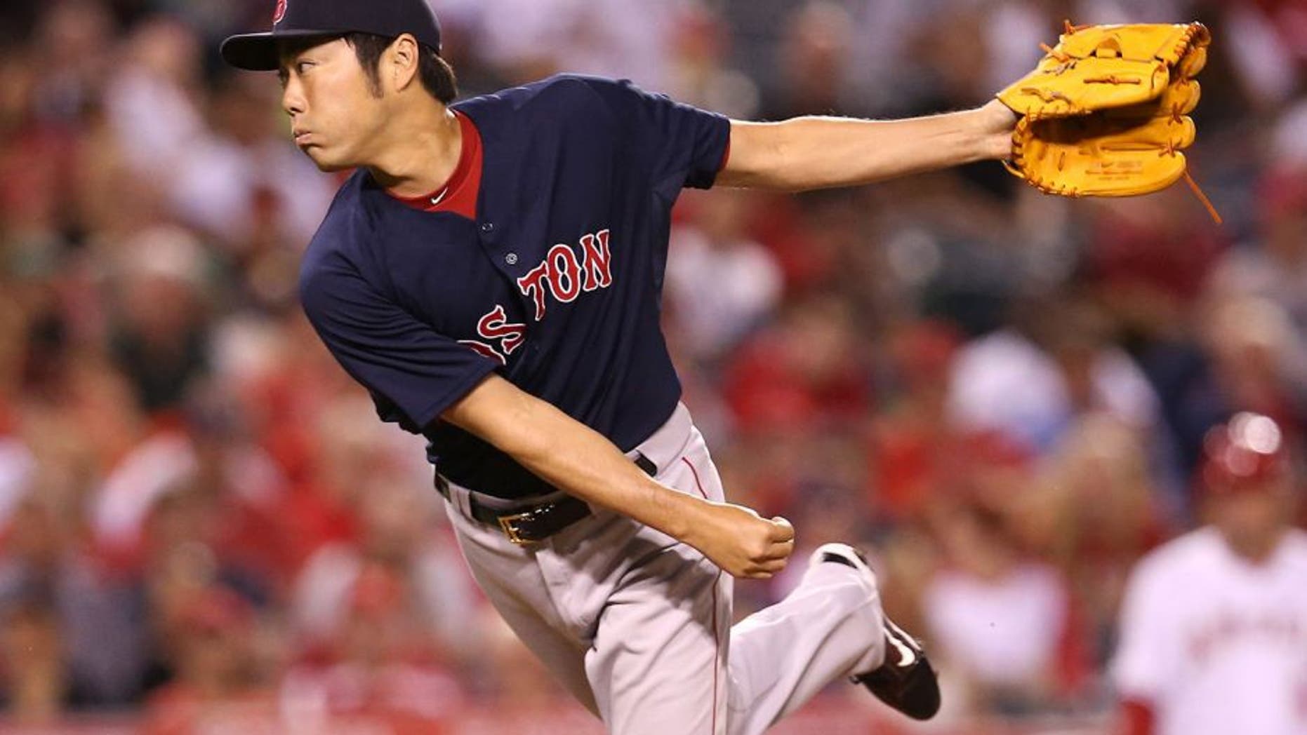 ANAHEIM, CA - JULY 17: Closer Koji Uehara#19 of the Boston Red Sox throws a pitch in the ninth inning the Los Angeles Angels of Anaheim at Angel Stadium of Anaheim on July 17, 2015 in Anaheim, California. The Angels won 1-0. (Photo by Stephen Dunn/Getty Images)