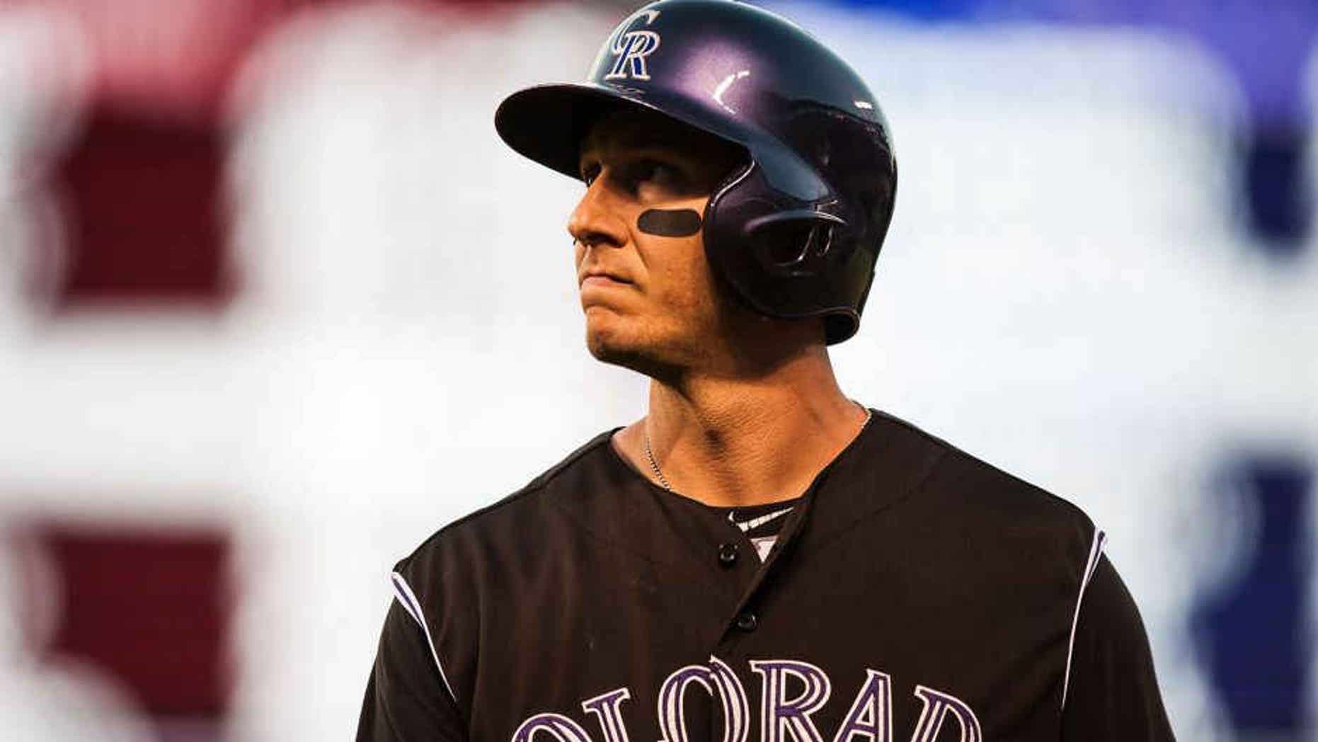 DENVER, CO - JULY 25: Troy Tulowitzki #2 of the Colorado Rockies reacts after flying out in the seventh inning of a game against the Cincinnati Reds at Coors Field on July 25, 2015 in Denver, Colorado. (Photo by Dustin Bradford/Getty Images)