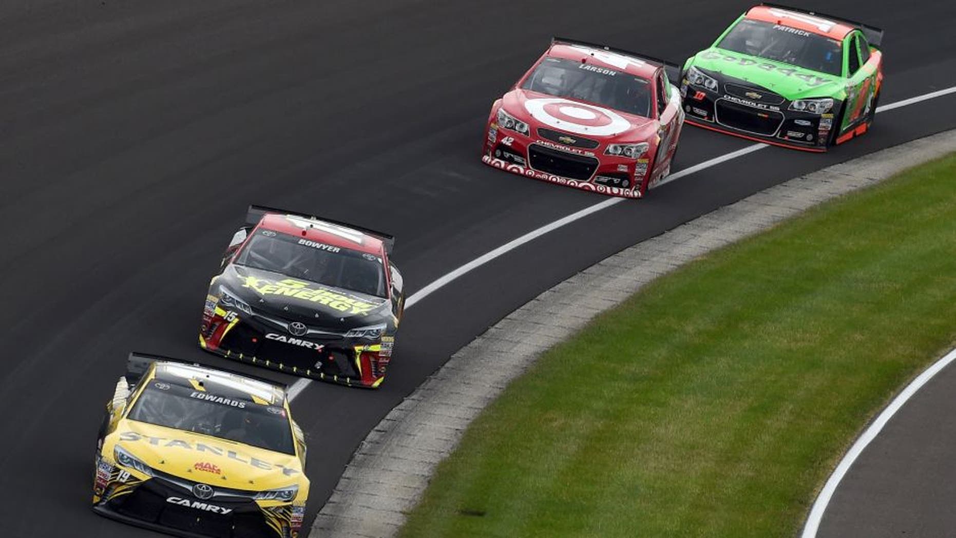 INDIANAPOLIS, IN - JULY 26: Carl Edwards, driver of the #19 Stanley Toyota, leads a pack of cars during the NASCAR Sprint Cup Series Crown Royal Presents the Jeff Kyle 400 at the Brickyard at Indianapolis Motor Speedway on July 26, 2015 in Indianapolis, Indiana. (Photo by Rainier Ehrhardt/NASCAR via Getty Images)