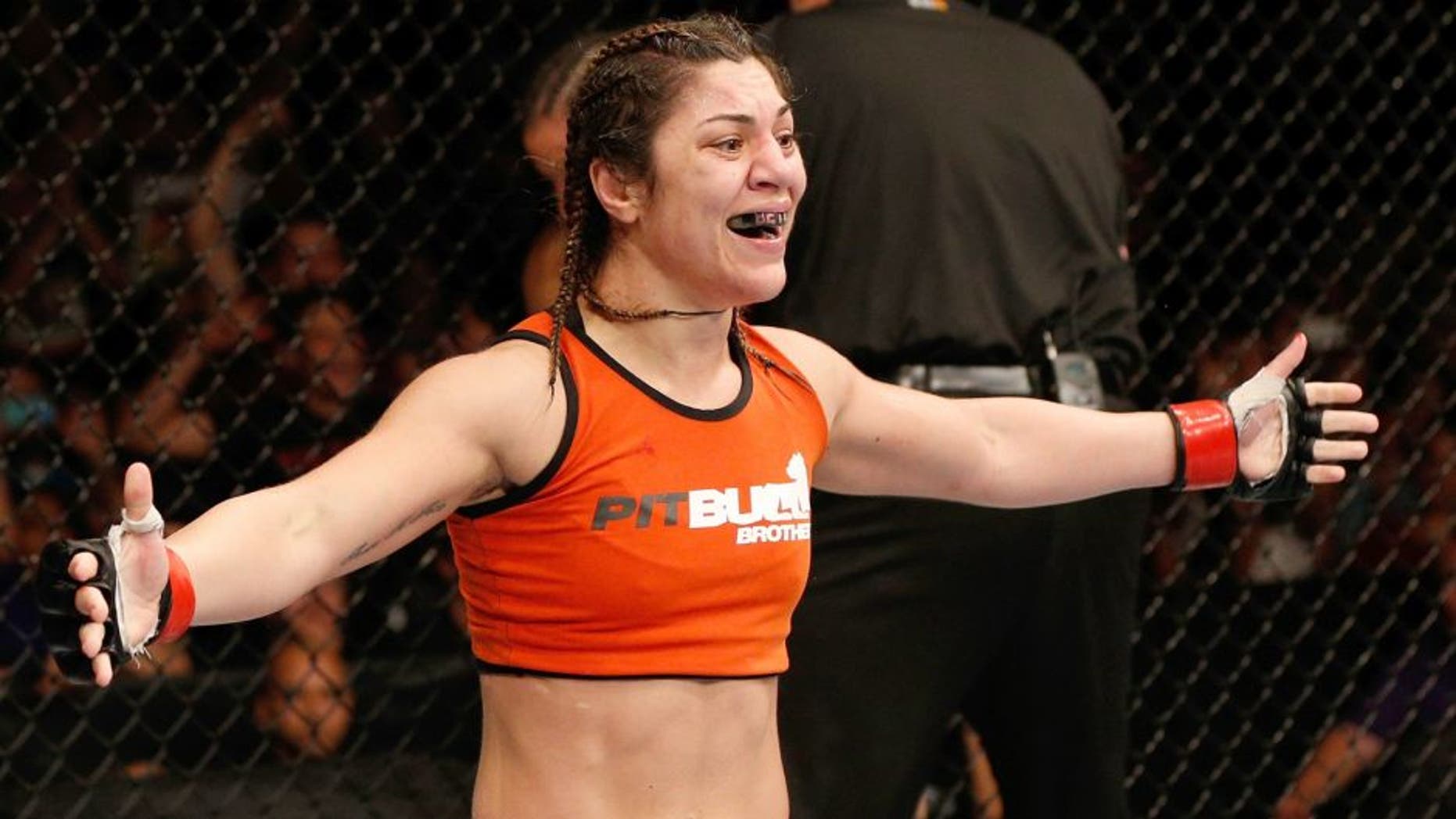 SACRAMENTO, CA - AUGUST 30: Bethe Correia of Brazil celebrates after her TKO victory over Shayna Baszler in their women's bantamweight bout during the UFC 177 event at Sleep Train Arena on August 30, 2014 in Sacramento, California. (Photo by Josh Hedges/Zuffa LLC/Zuffa LLC via Getty Images)