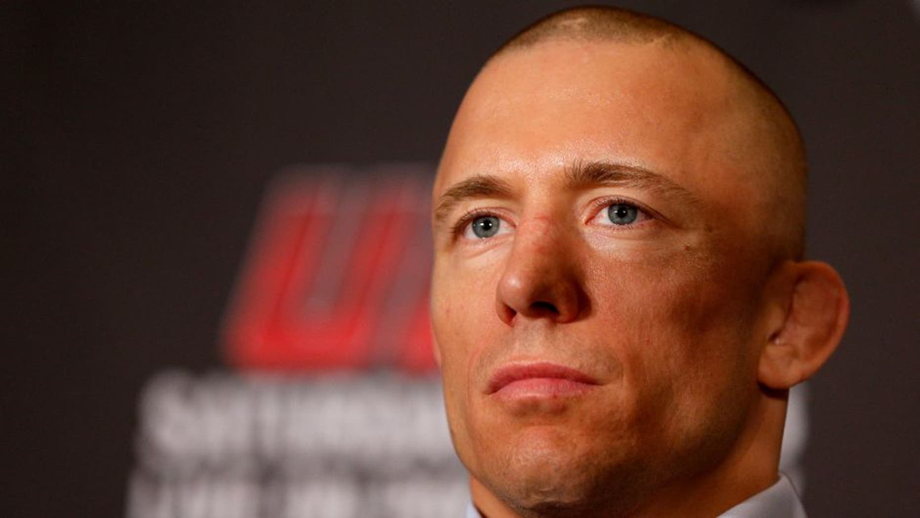 MONTREAL, QC - MARCH 14: Georges St-Pierre interacts with media during the final press conference ahead of his UFC 158 bout at Bell Centre on March 14, 2013 in Montreal, Quebec, Canada. (Photo by Josh Hedges/Zuffa LLC/Zuffa LLC via Getty Images)