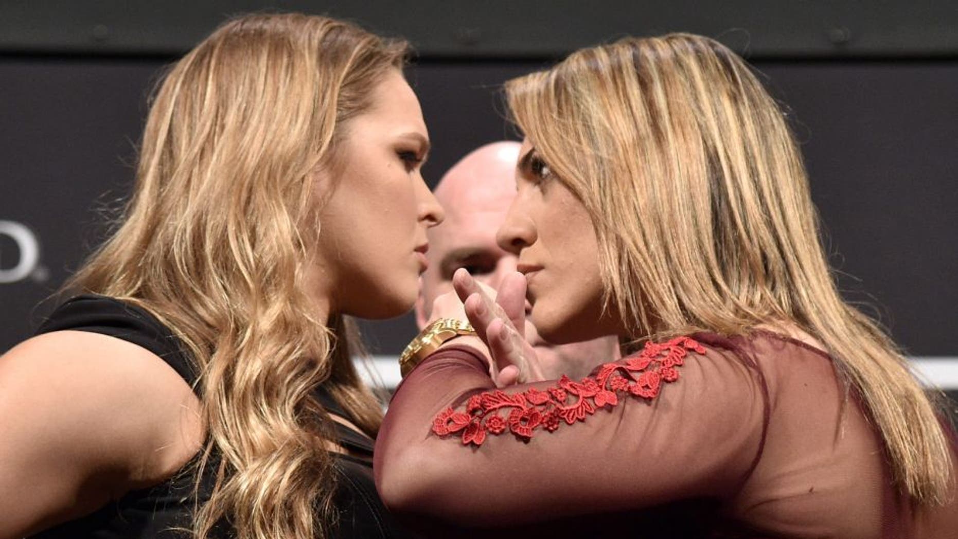 RIO DE JANEIRO, BRAZIL - MARCH 20: (EDITORS NOTE: Retransmission with alternate crop.) UFC Women's Bantamweight Champion Ronda Rousey of the United States and Bethe Correia of Brazil face off as UFC President Dana White (C) stands in during the 189 World Media Tour Launch press conference at Maracanazinho on March 20, 2015 in Rio de Janeiro, Brazil. (Photo by Buda Mendes/Zuffa LLC/Zuffa LLC via Getty Images)