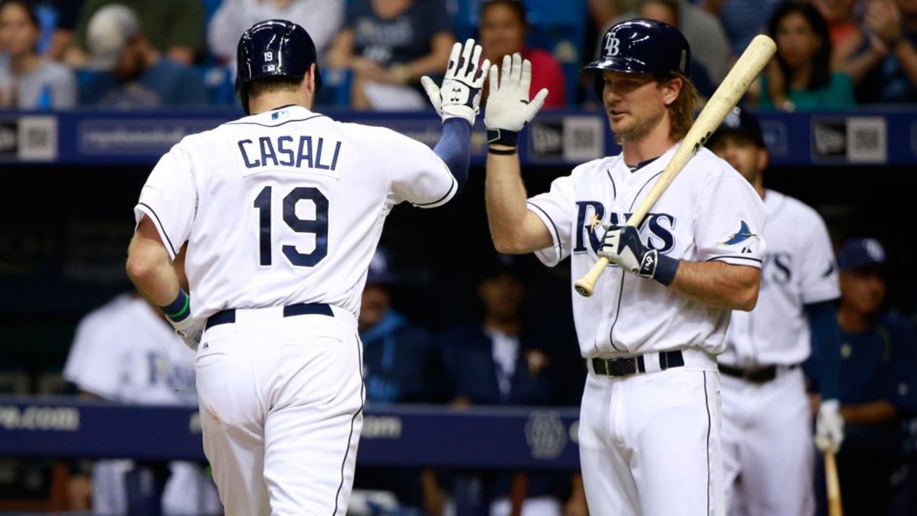 Jul 27, 2015; St. Petersburg, FL, USA; Tampa Bay Rays catcher Curt Casali (19) is congratulated by designated hitter John Jaso (28) after he hit a solo home run during the third inning against the Detroit Tigers at Tropicana Field. Mandatory Credit: Kim Klement-USA TODAY Sports