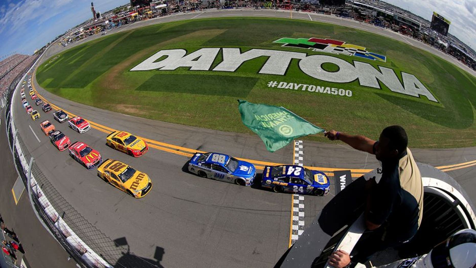 DAYTONA BEACH, FL - FEBRUARY 21: Ken Griffey Jr waves the green flag as Chase Elliott, driver of the #24 NAPA Auto Parts Chevrolet, leads the field to start the NASCAR Sprint Cup Series DAYTONA 500 at Daytona International Speedway on February 21, 2016 in Daytona Beach, Florida. (Photo by Chris Trotman/NASCAR via Getty Images)