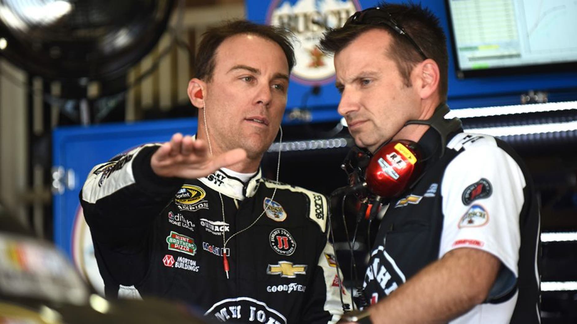 FONTANA, CA - MARCH 18: Kevin Harvick, driver of the #4 Jimmy John's Chevrolet, talks to his crew chief, Rodney Childers, during practice for the NASCAR Sprint Cup Series Auto Club 400 at Auto Club Speedway on March 18, 2016 in Fontana, California. (Photo by Jonathan Moore/Getty Images)