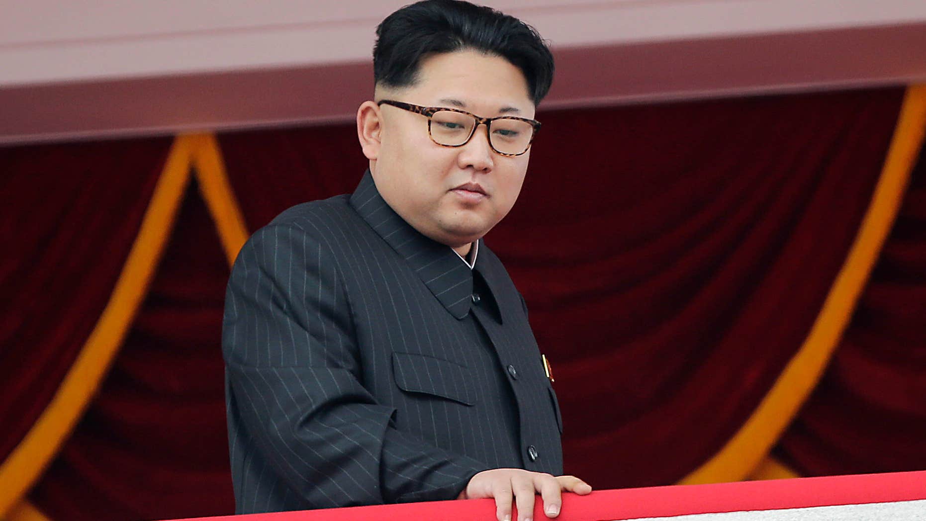In this May 10, 2016, photo, North Korea's leader Kim Jong Un watches a parade from a balcony at the Kim Il Sung Square in Pyongyang.