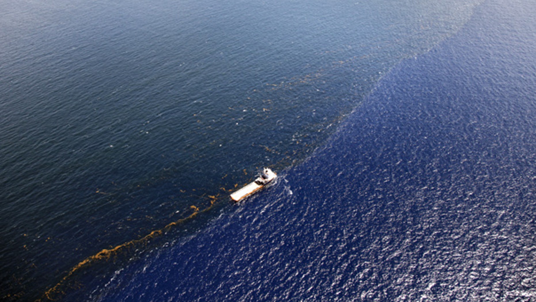 July 26: A response vessel is seen along a line of emulsified oil between the Deepwater Horizon spill site and the Louisiana coast.