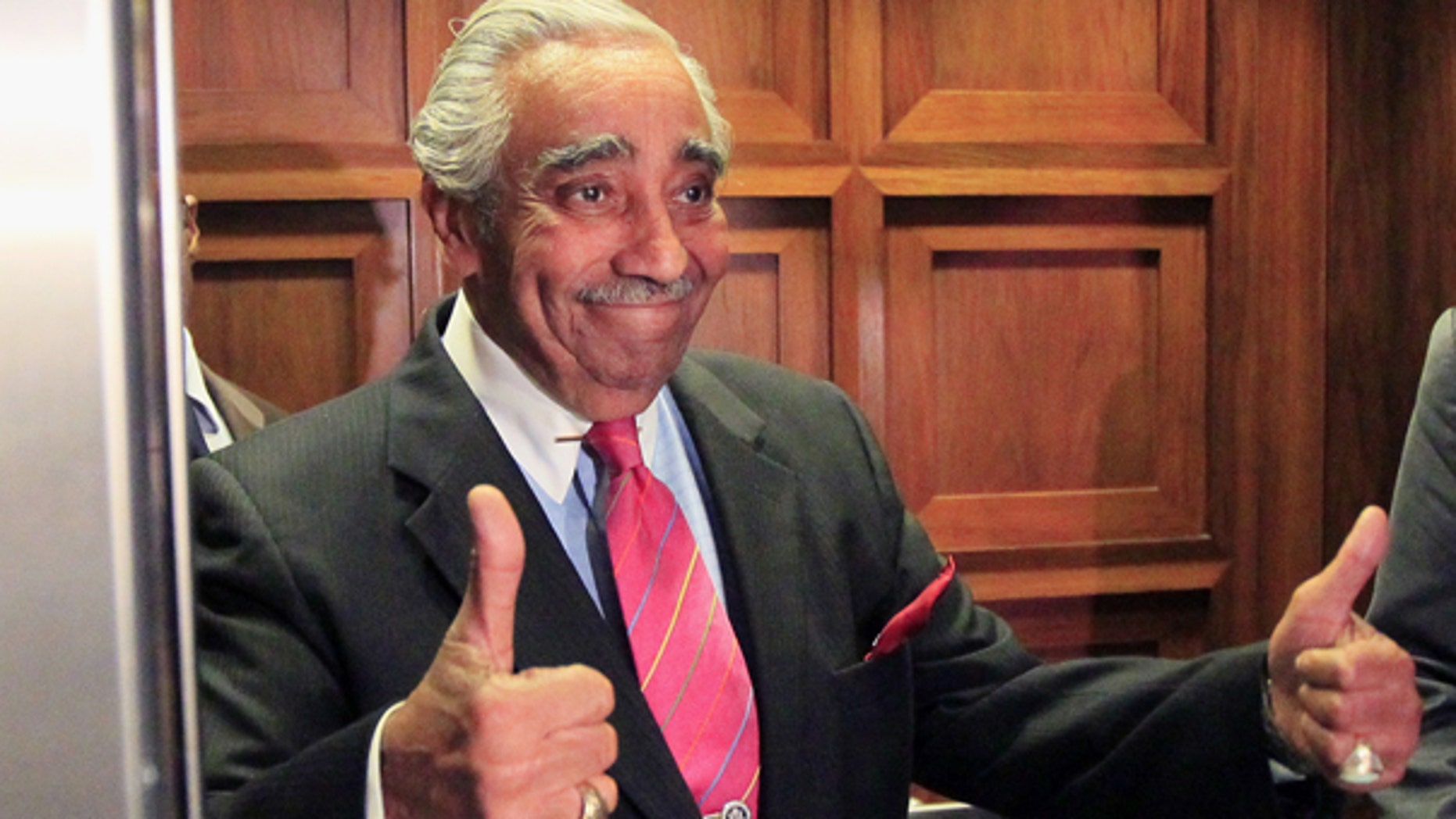 July 28: Rep. Charles Rangel, D-N.Y., gives thumbs up as he gets in the elevator to leave his office for a vote on Capitol Hill in Washington. (AP)