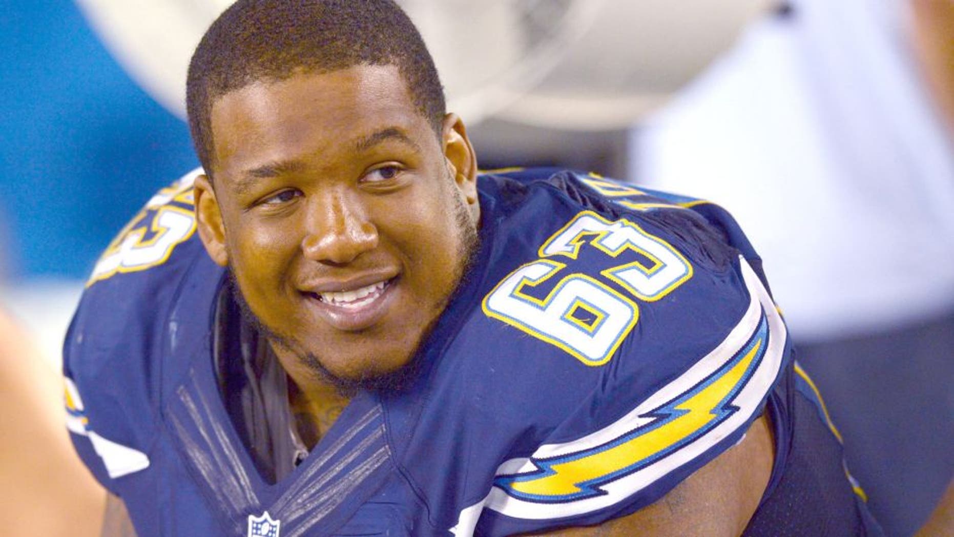 Aug 7, 2014; San Diego, CA, USA; San Diego Chargers guard Johnnie Troutman (63) smiles on the sidelines during the fourth quarter against the Dallas Cowboys at Qualcomm Stadium. Mandatory Credit: Jake Roth-USA TODAY Sports