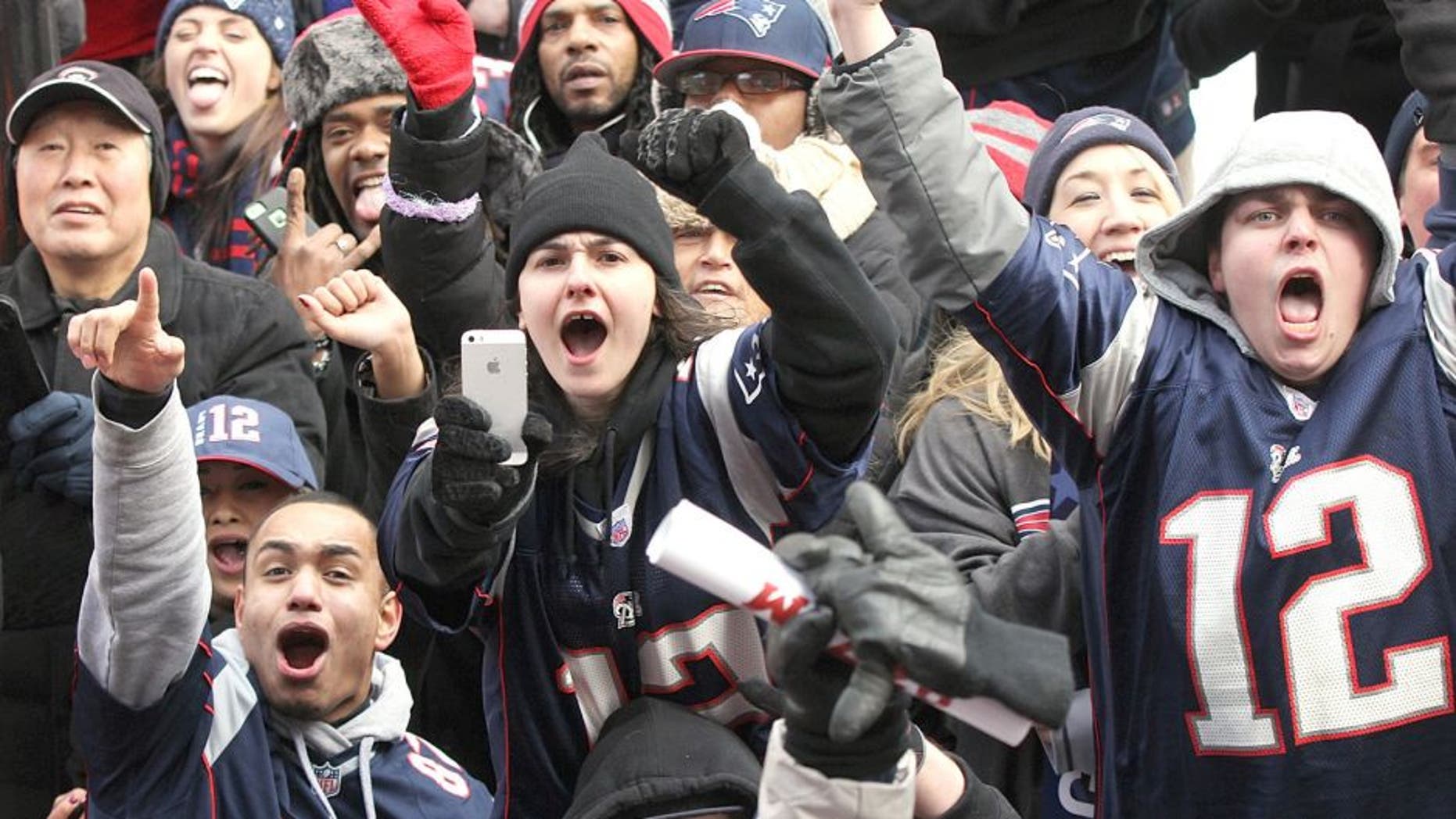 BOSTON - FEBRUARY 4: Patriots fans cheer as the Super Bowl victory parade made its way up Boylston Street in Boston on February 4, 2015. (Photo by Wendy Maeda/The Boston Globe via Getty Images)