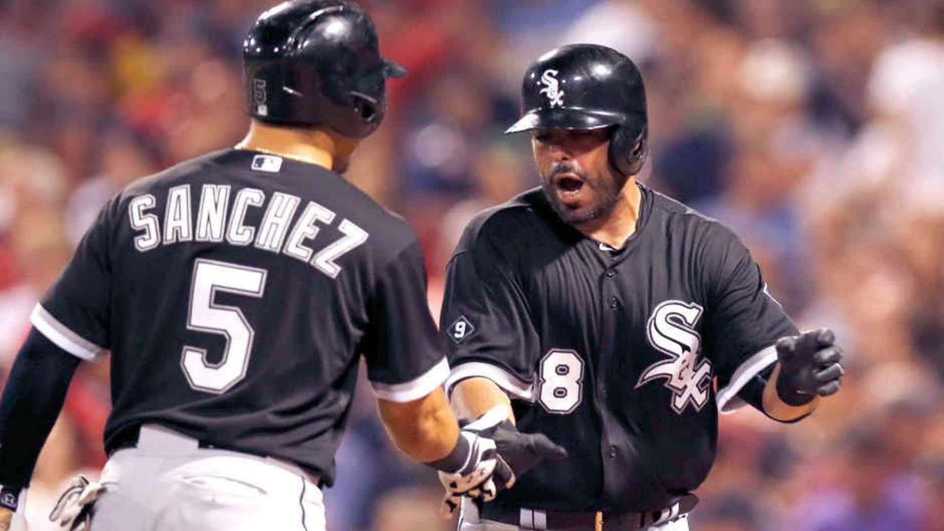 Jul 28, 2015; Boston, MA, USA; Chicago White Sox catcher Geovany Soto (58) is congratulated second baseman Carlos Sanchez (5) after hitting a home run during the seventh inning at Fenway Park. Mandatory Credit: Greg M. Cooper-USA TODAY Sports