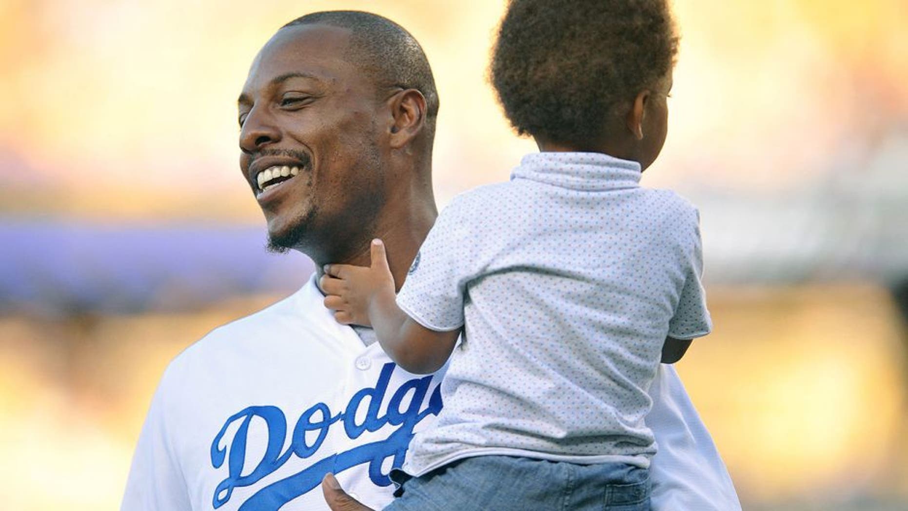July 28, 2015; Los Angeles, CA, USA; Los Angeles Clippers forward Paul Pierce in attendance with son Prince before the Los Angeles Dodgers play against the Oakland Athletics at Dodger Stadium. Mandatory Credit: Gary A. Vasquez-USA TODAY Sports