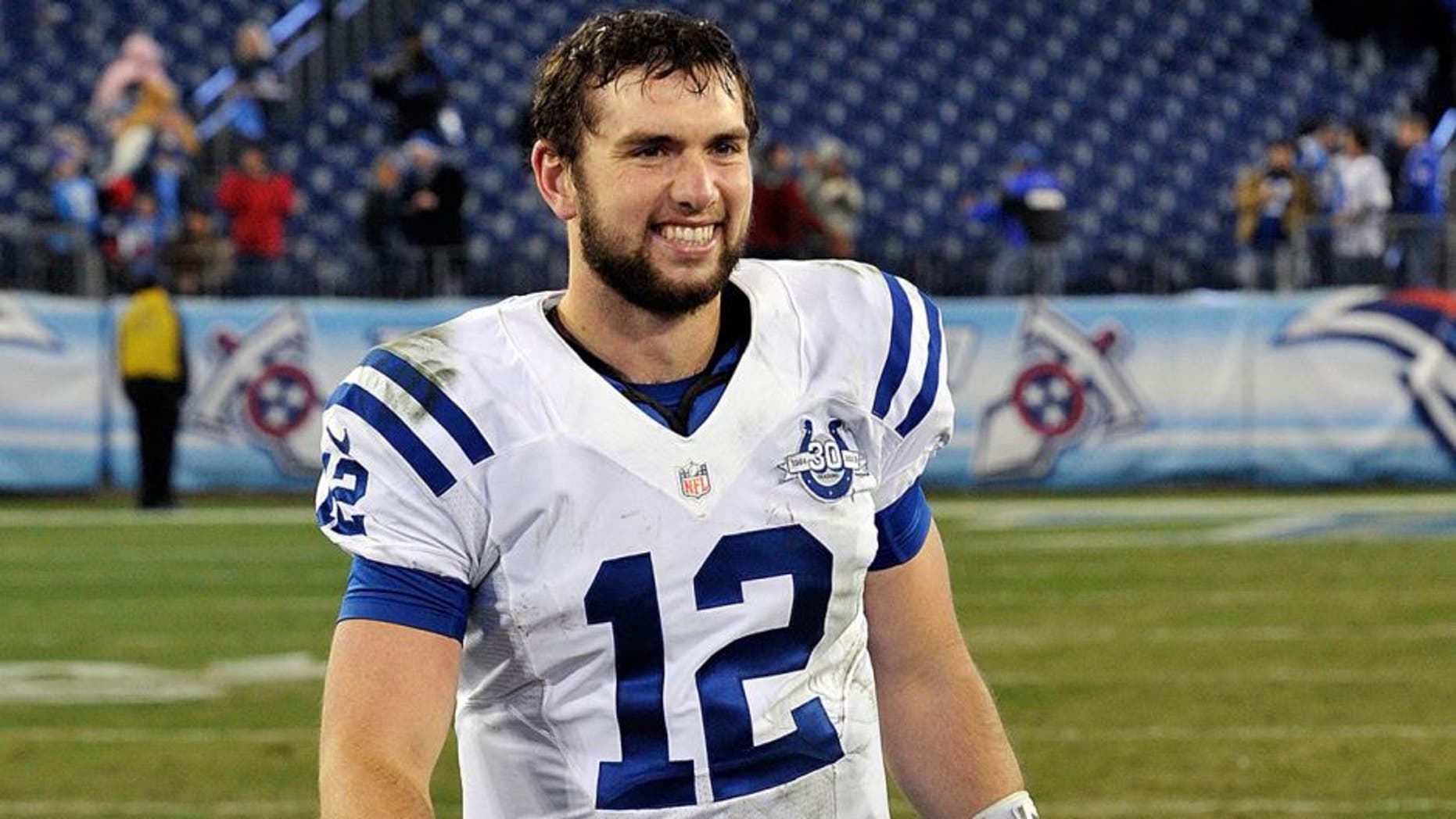 NASHVILLE, TN - NOVEMBER 14: Quarterback Andrew Luck #12 of the Indianapolis Colts smiles as he leaves the field after a 30-27 Colts victory over the Tennessee Titans at LP Field on November 14, 2013 in Nashville, Tennessee. (Photo by Frederick Breedon/Getty Images)