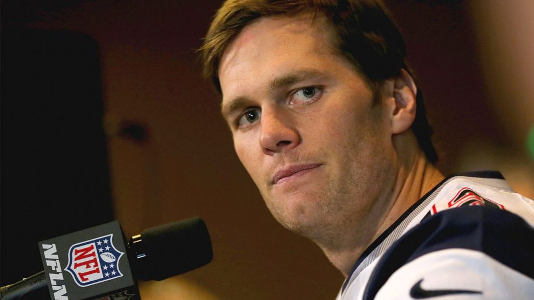 CHANDLER, AZ - JANUARY 28: Quarterback Tom Brady #12 of the New England Patriots speaks with the media on January 28, 2015 in Chandler, Arizona. (Photo by Elsa/Getty Images)