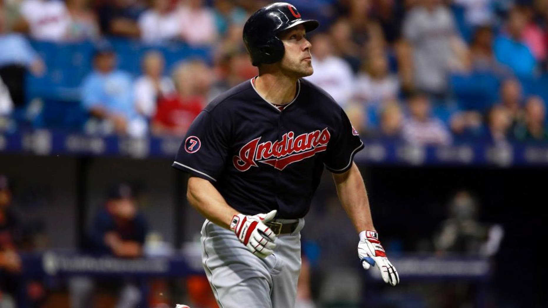 Jun 30, 2015; St. Petersburg, FL, USA; Cleveland Indians designated hitter David Murphy (7) hits a two run home run during the eighth inning against the Tampa Bay Rays at Tropicana Field. Mandatory Credit: Kim Klement-USA TODAY Sports