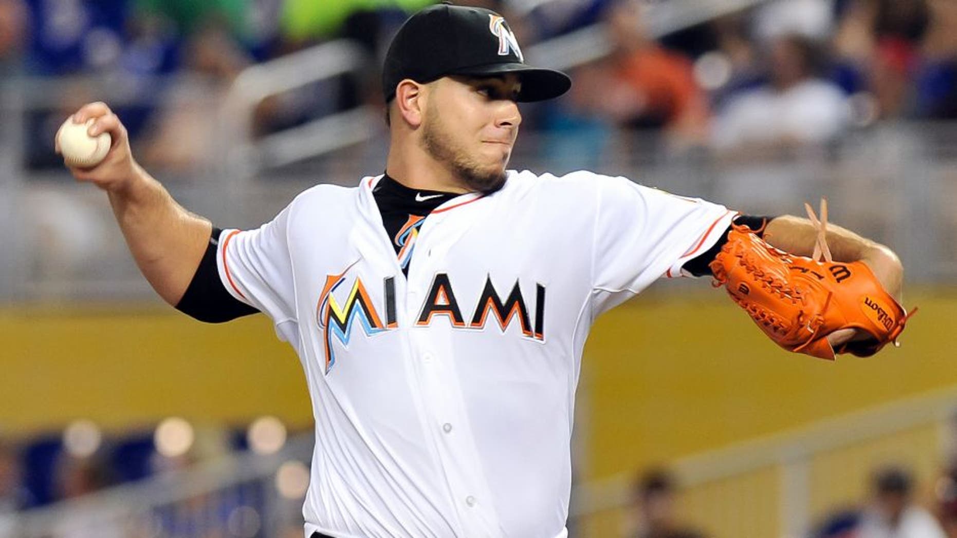 Jul 28, 2015; Miami, FL, USA; Miami Marlins starting pitcher Jose Fernandez (16) delivers a pitch against the Washington Nationals during the first inning at Marlins Park. Mandatory Credit: Steve Mitchell-USA TODAY Sports