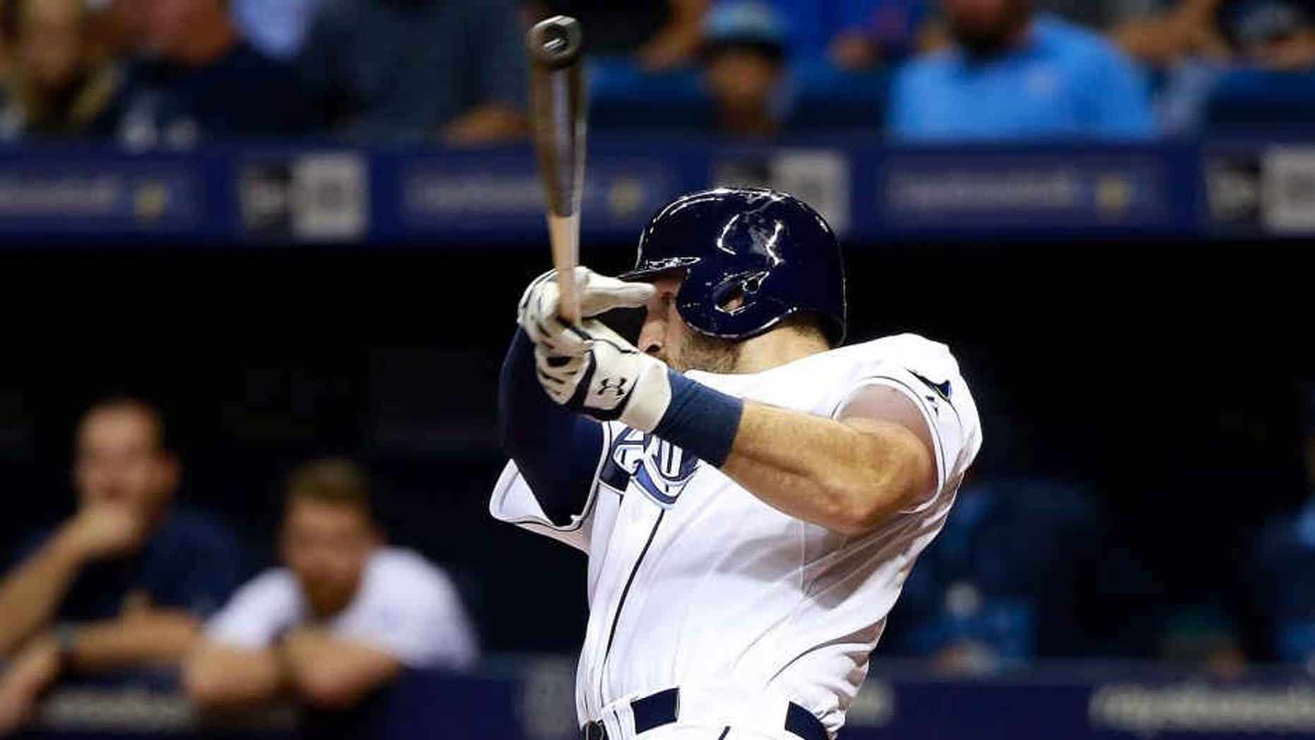 Jul 28, 2015; St. Petersburg, FL, USA; Tampa Bay Rays catcher Curt Casali (19) hits a two-run home run during the fourth inning against the Detroit Tigers at Tropicana Field. Mandatory Credit: Kim Klement-USA TODAY Sports