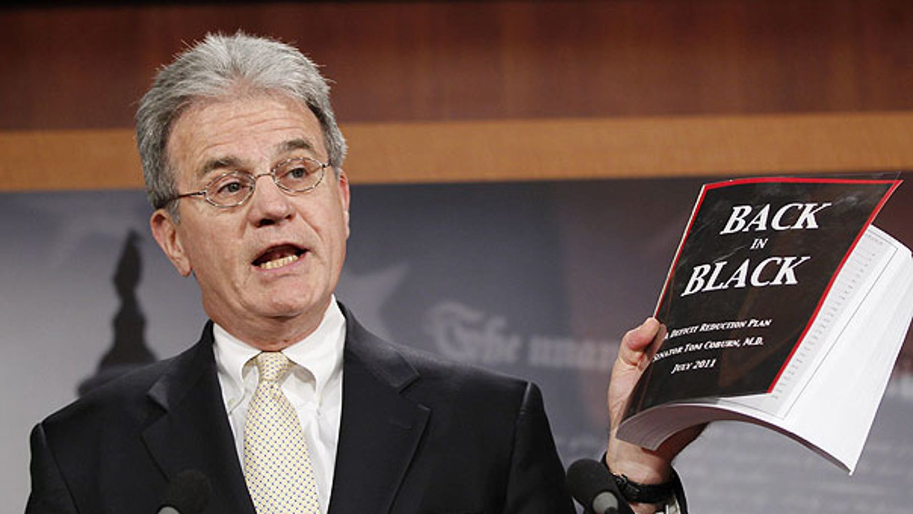 July 18: Sen. Tom Coburn, R-Okla. reveals his "Back in Black" plan to reduce the federal deficit during a news conference on Capitol Hill in Washington.