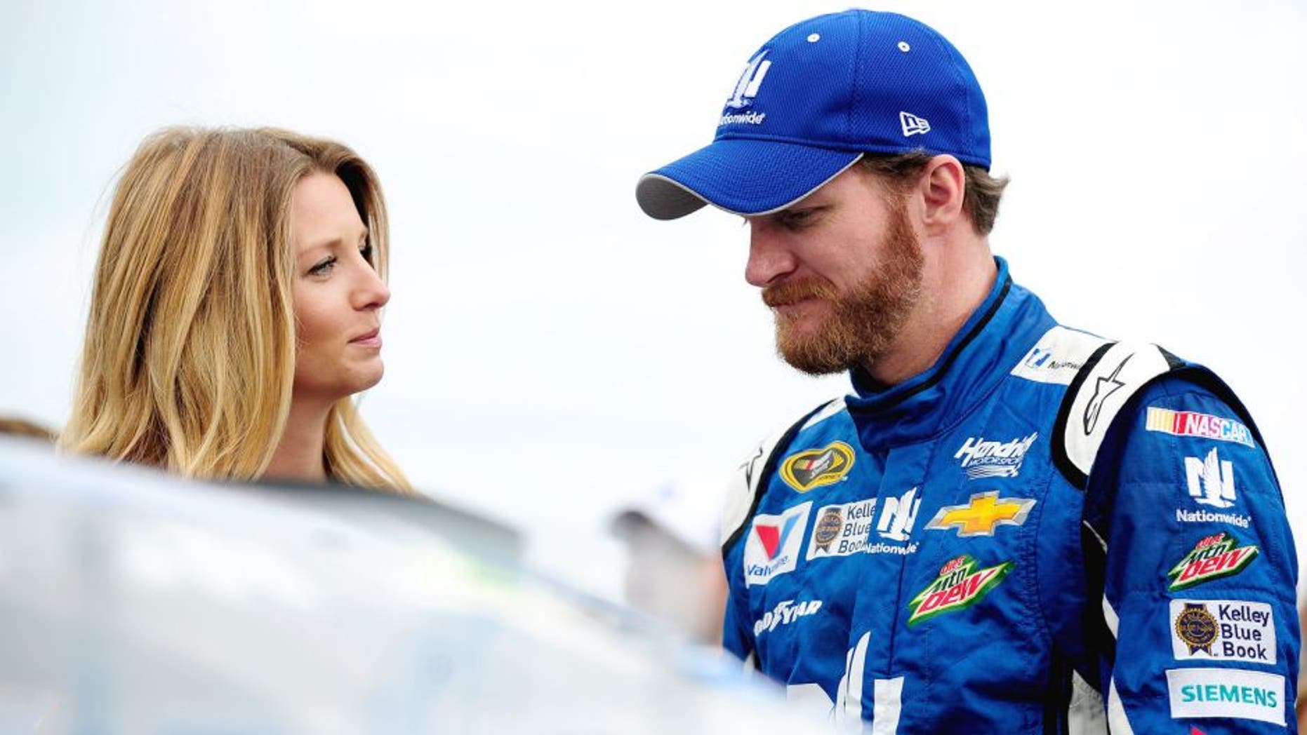 SPARTA, KY - JULY 11: Dale Earnhardt Jr., driver of the #88 Nationwide Chevrolet, right, takes part in pre-race ceremonies with fiancee Amy Reimann prior to the NASCAR Sprint Cup Series Quaker State 400 presented by Advance Auto Parts at Kentucky Speedway on July 11, 2015 in Sparta, Kentucky. (Photo by Jeff Curry/Getty Images)