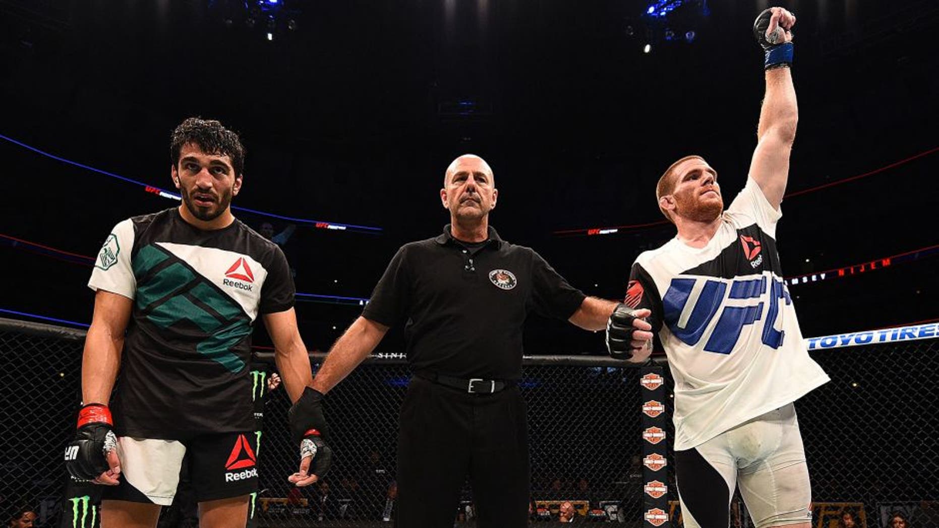CHICAGO, IL - JULY 25: Andrew Holbrook (R) reacts after his split-decision victory over Ramsey Nijem in their lightweight bout during the UFC event at the United Center on July 25, 2015 in Chicago, Illinois. (Photo by Jeff Bottari/Zuffa LLC/Zuffa LLC via Getty Images)
