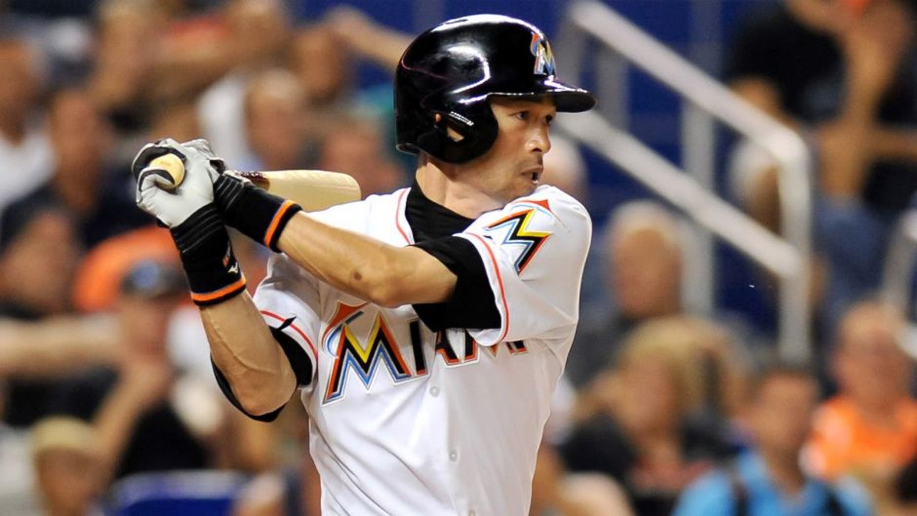 Jul 28, 2015; Miami, FL, USA; Miami Marlins left fielder Ichiro Suzuki (51) connects for a base hit during the fifth inning against the Washington Nationals at Marlins Park. Mandatory Credit: Steve Mitchell-USA TODAY Sports
